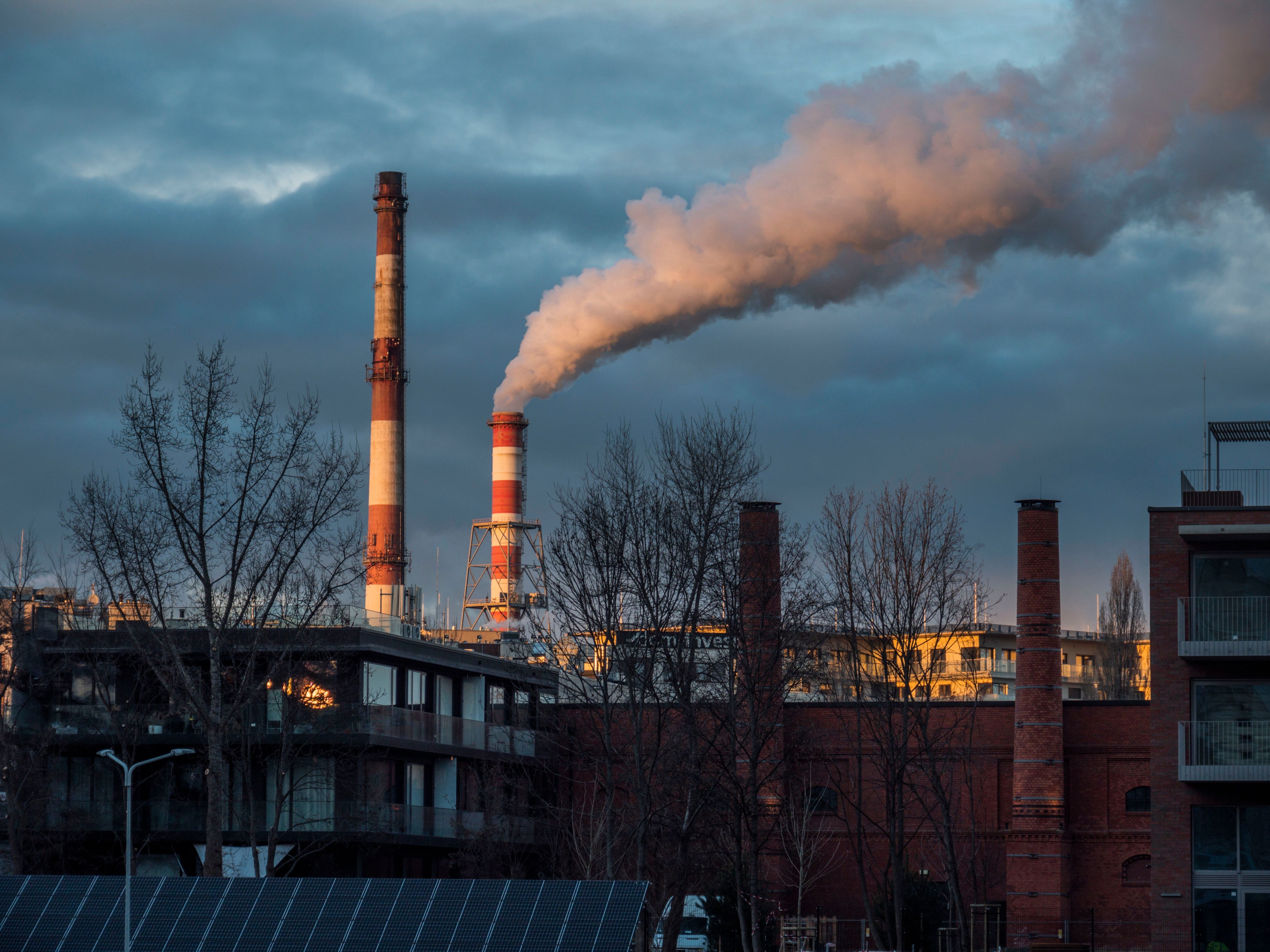 Industrial chimneys releasing smoke into the sky in Poland. (Photo: Pexels)