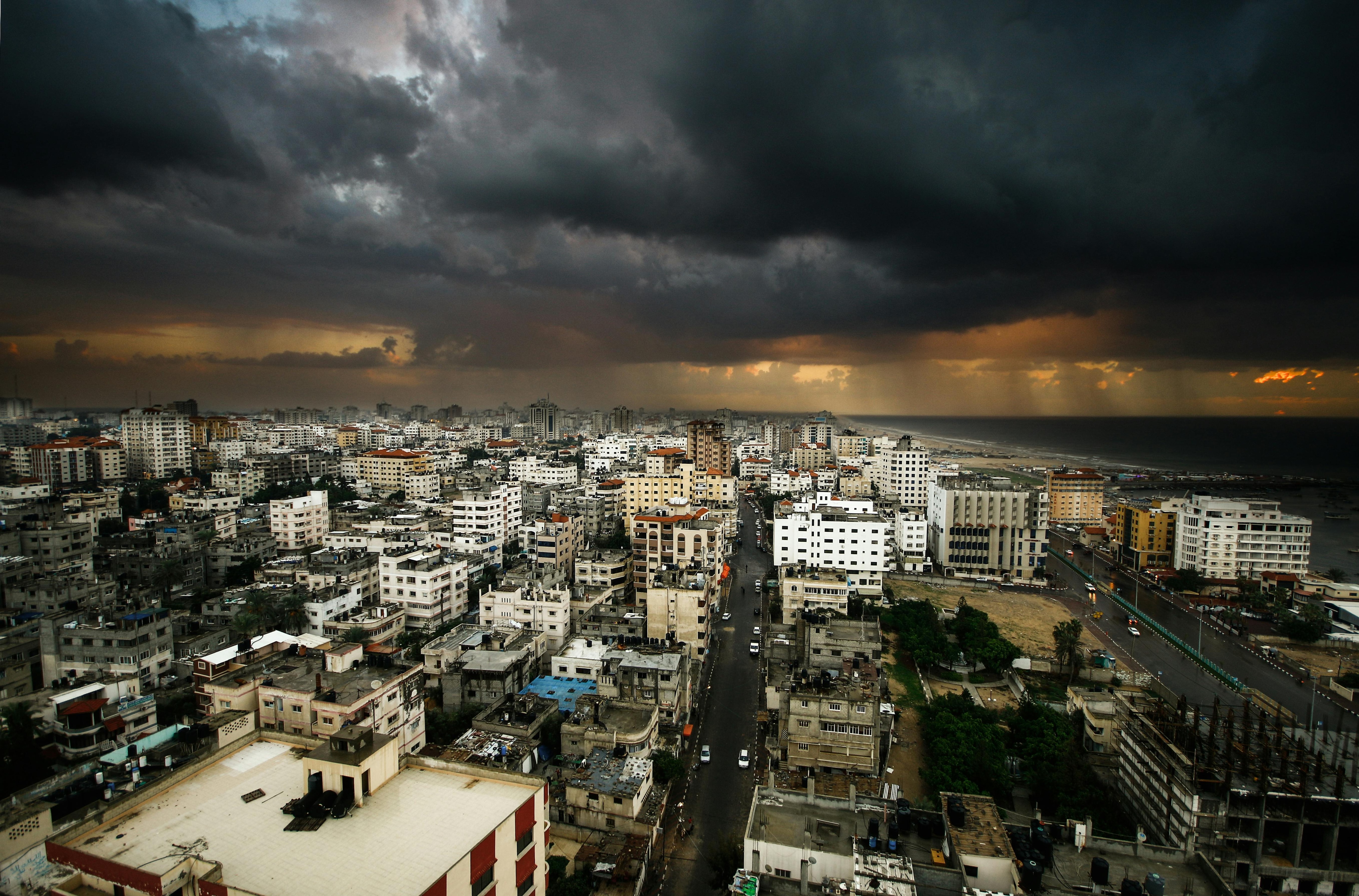 City view of Gaza under dark clouds with rain on the horizon illustarting weather and war. (Photo: Pexels)