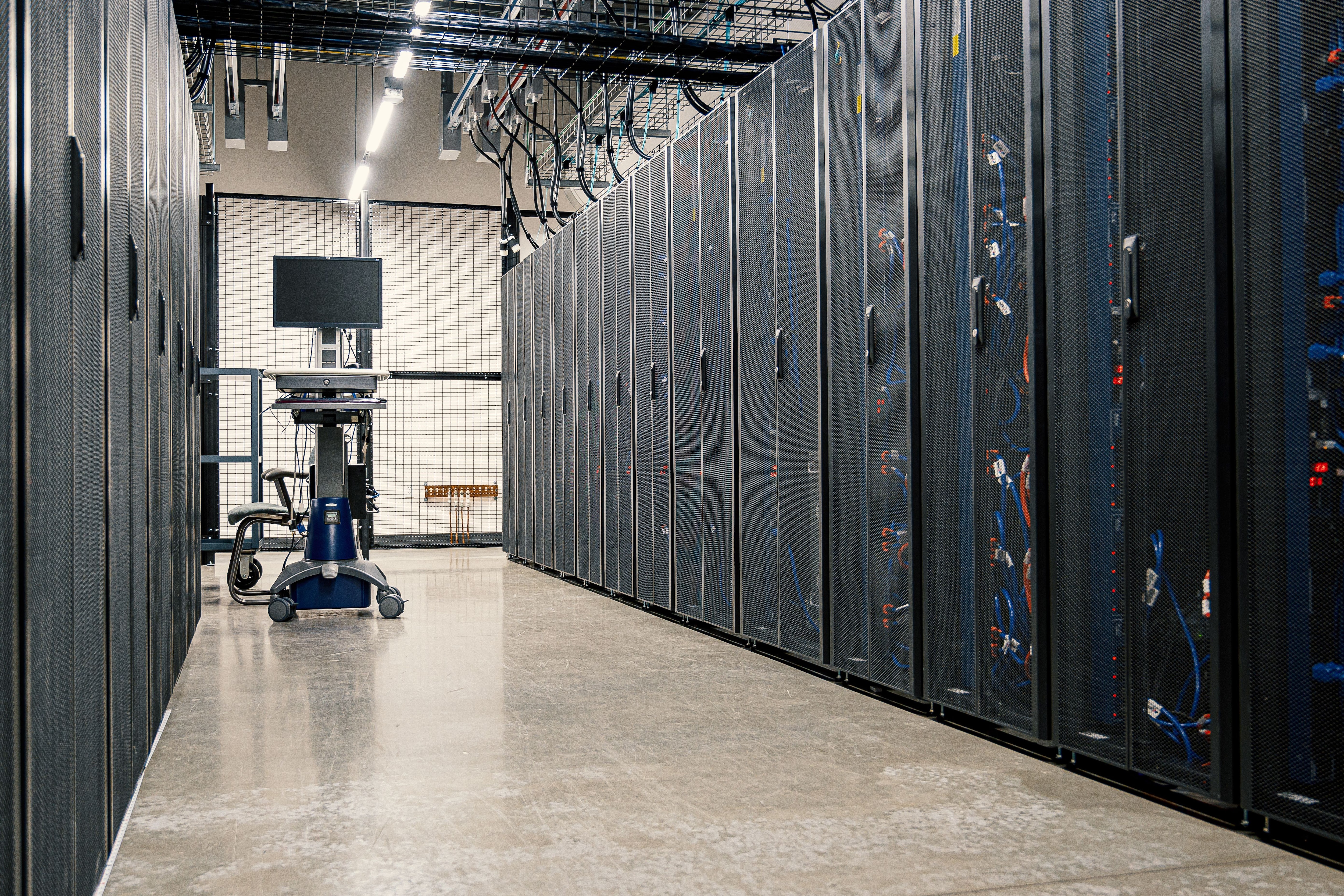 Servers networking devices and cables are seen in a data center. (Photo: Pexels)