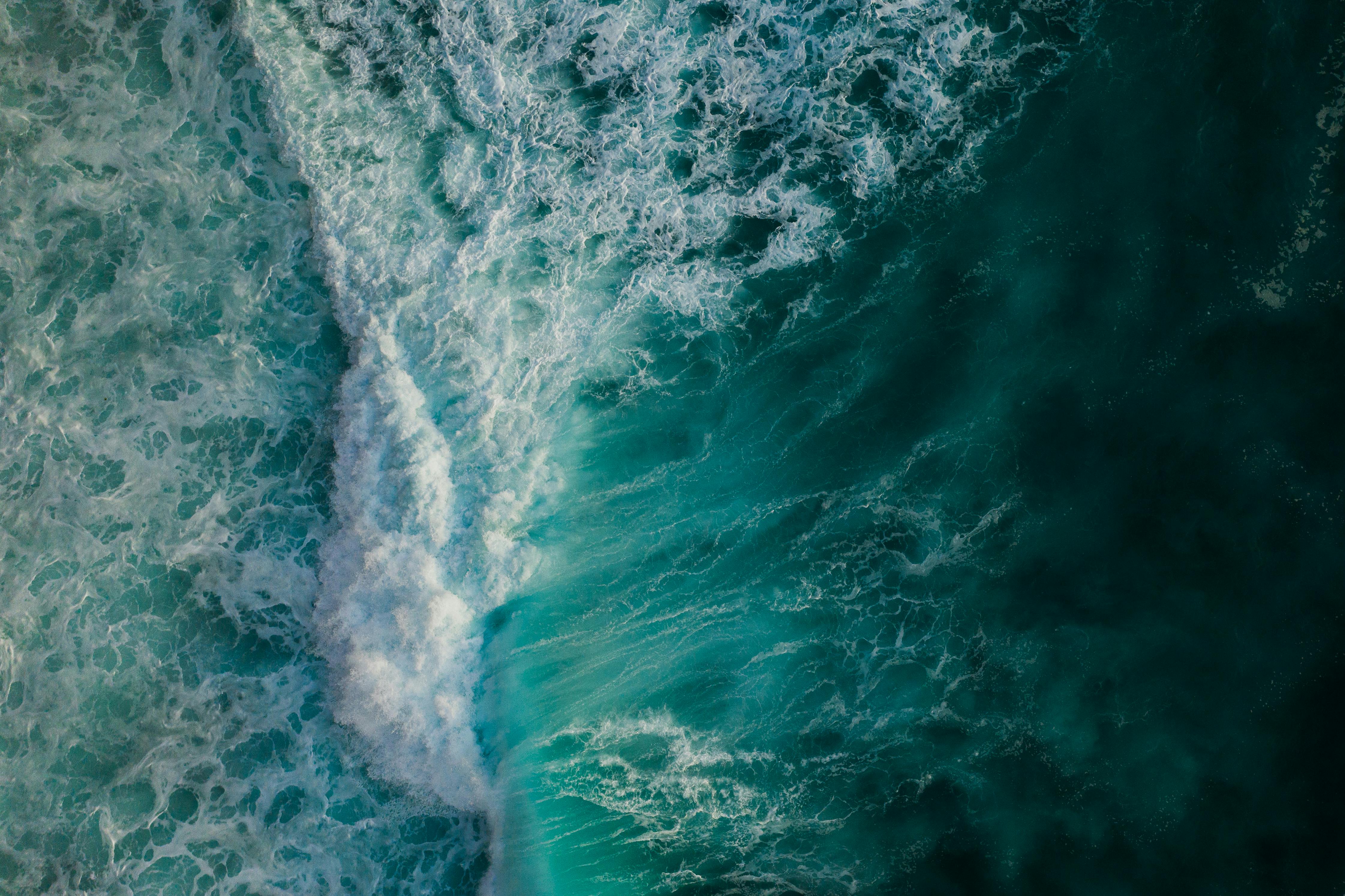 An aerial view capturing the vibrant movement of crashing ocean waves. (Representational Photo: Pexels)