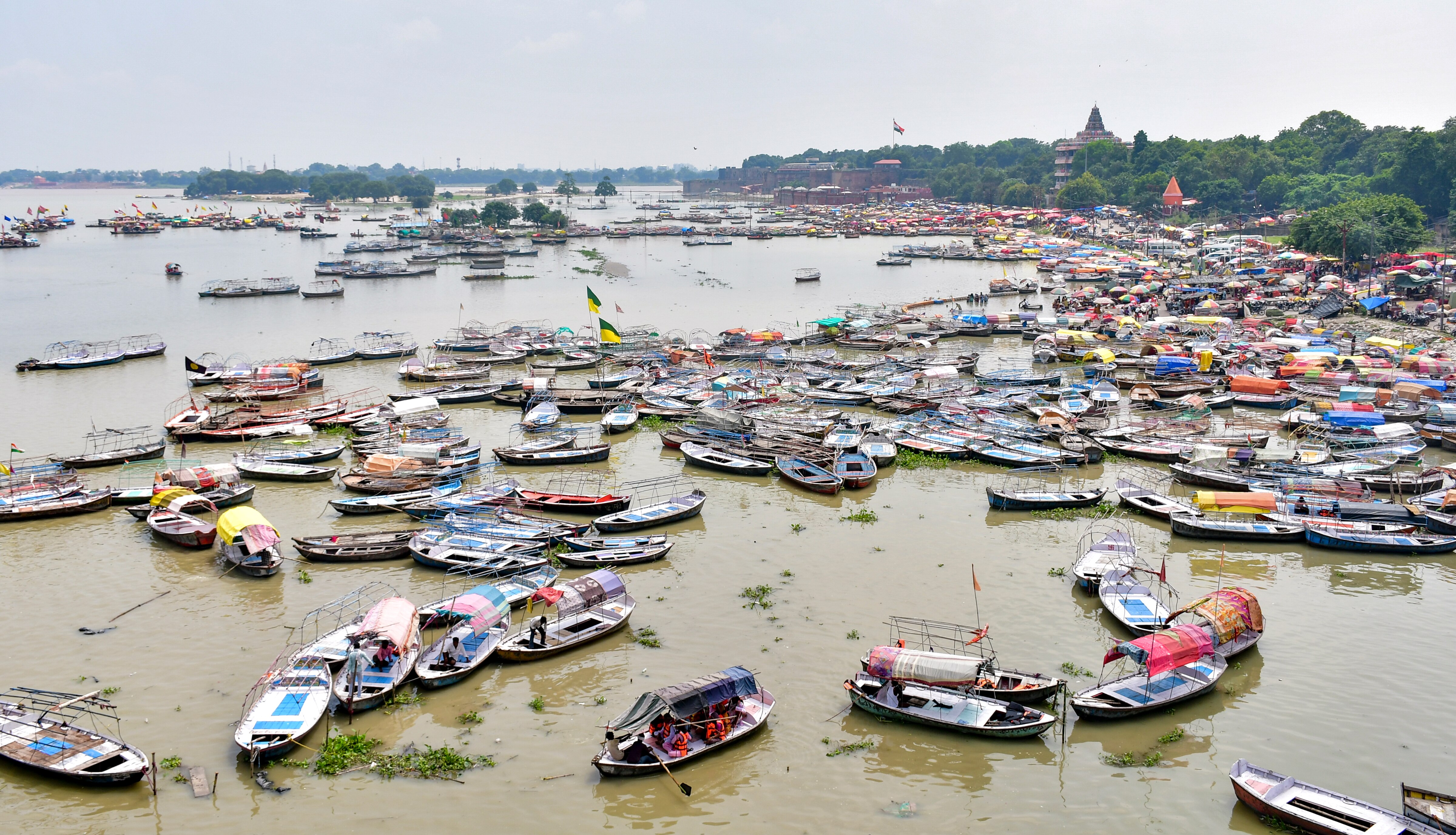 Boats are seen moored in swollen Ganga river following heavy rains. (Photo: PTI)