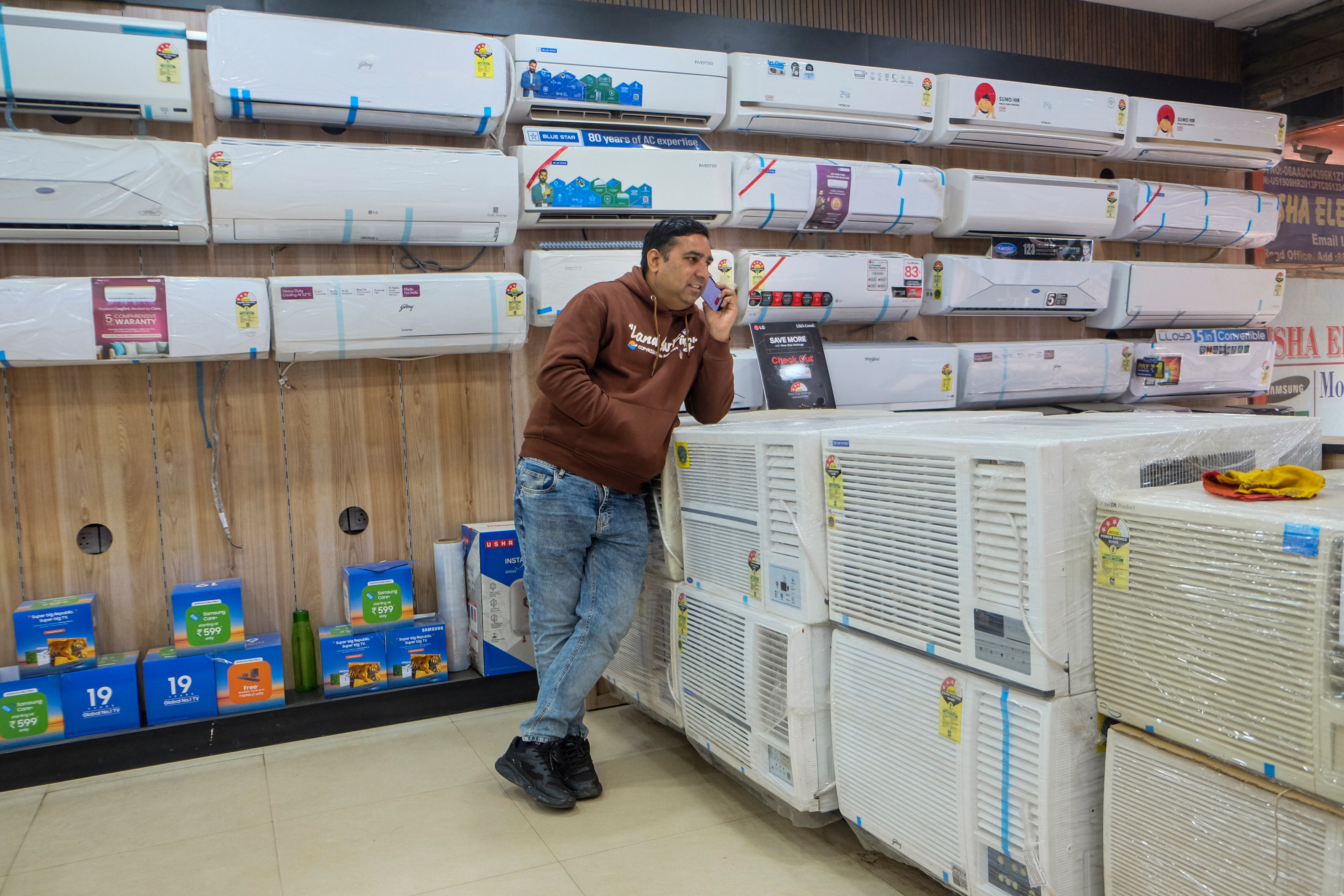 A man checks air conditioners displayed at a showroom in Gurugram, Haryana. (Photo: PTI)