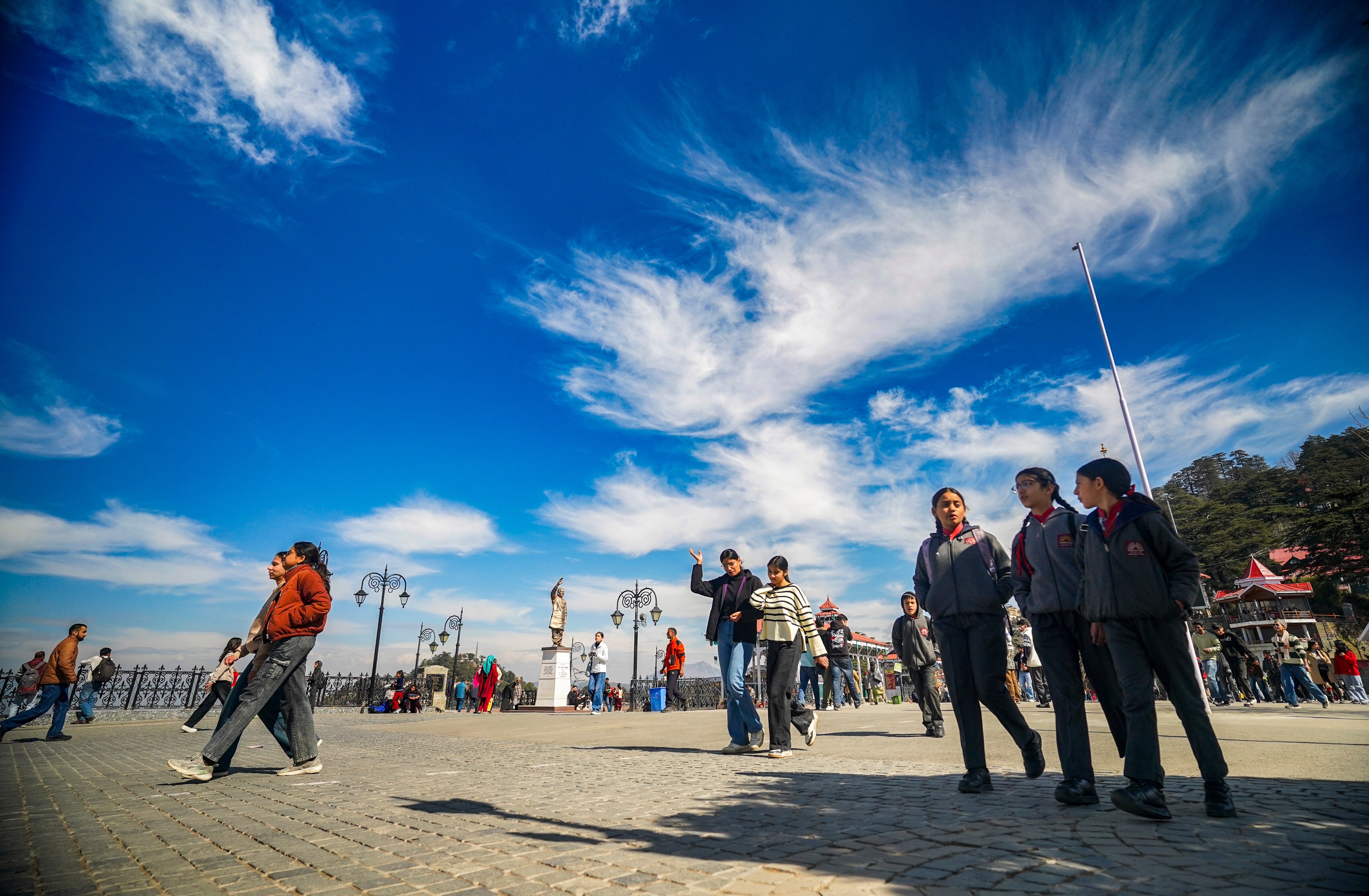 People walk under a clear sky and warm day in Shimla, Himachal Pradesh. (Photo: PTI)