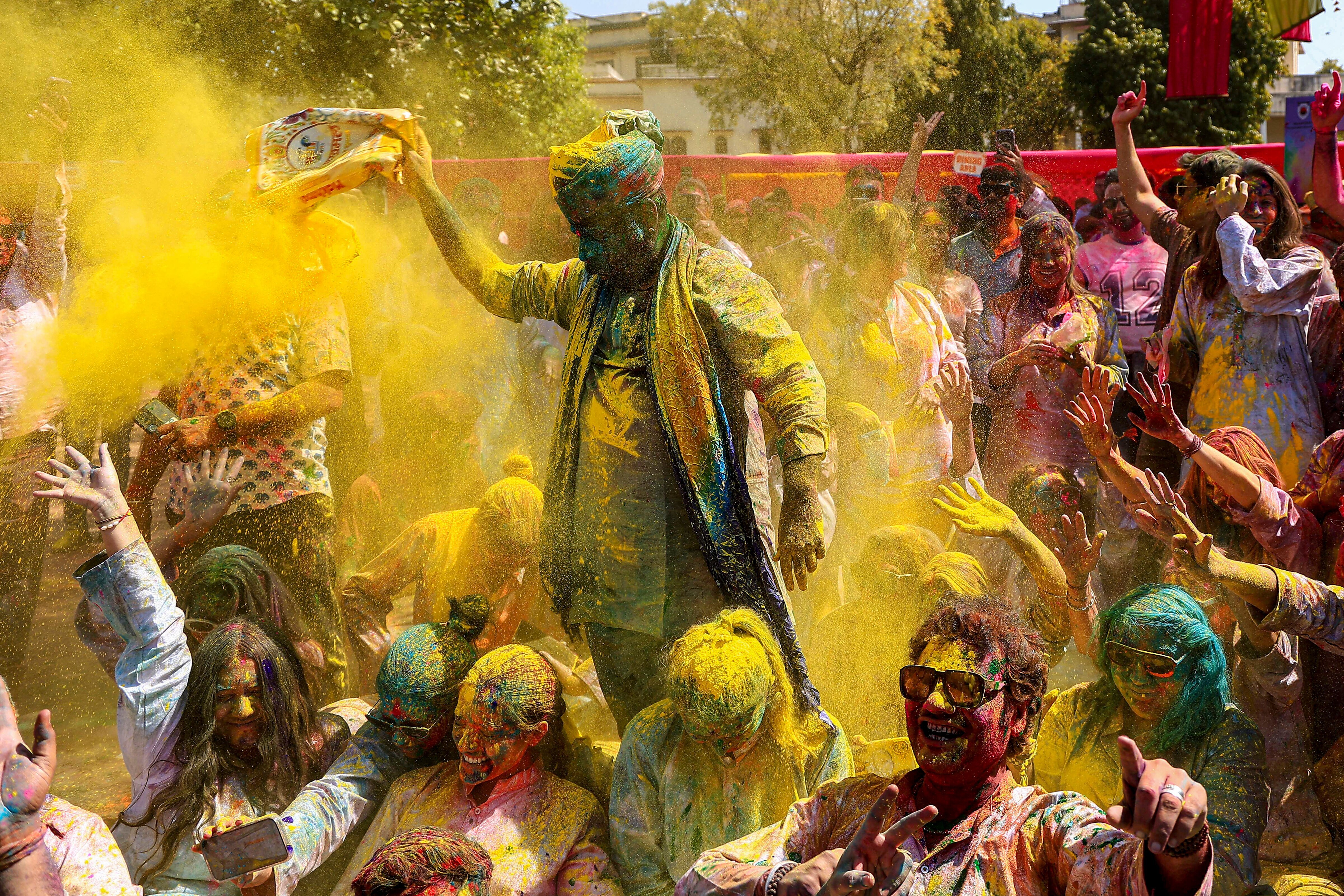 People smeared in colours during an event organised by Rajasthan Tourism in Jaipur. (Photo: PTI)