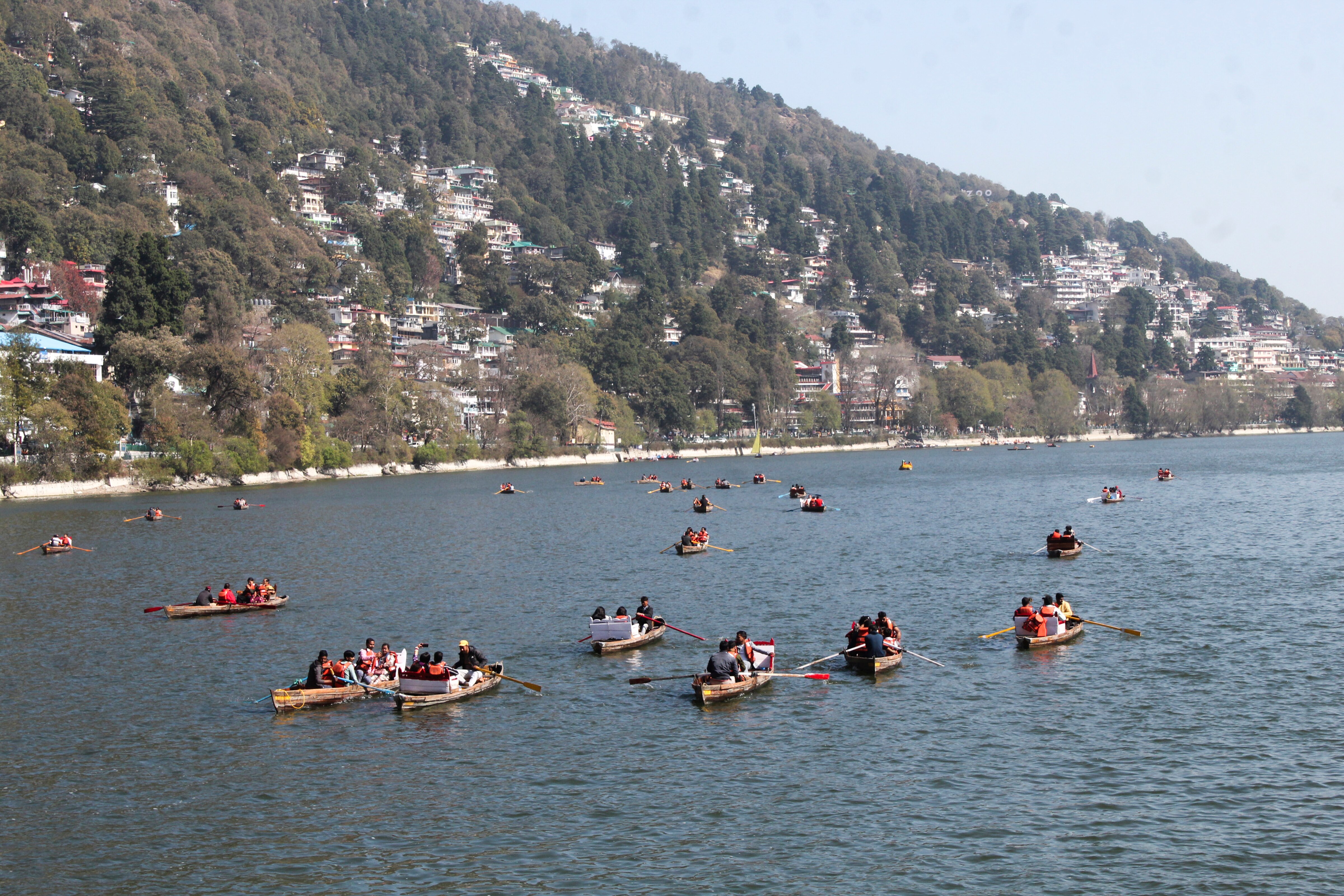Tourists take boat ride at the Naini Lake in Nainital on a warm day. (Photo: PTI)