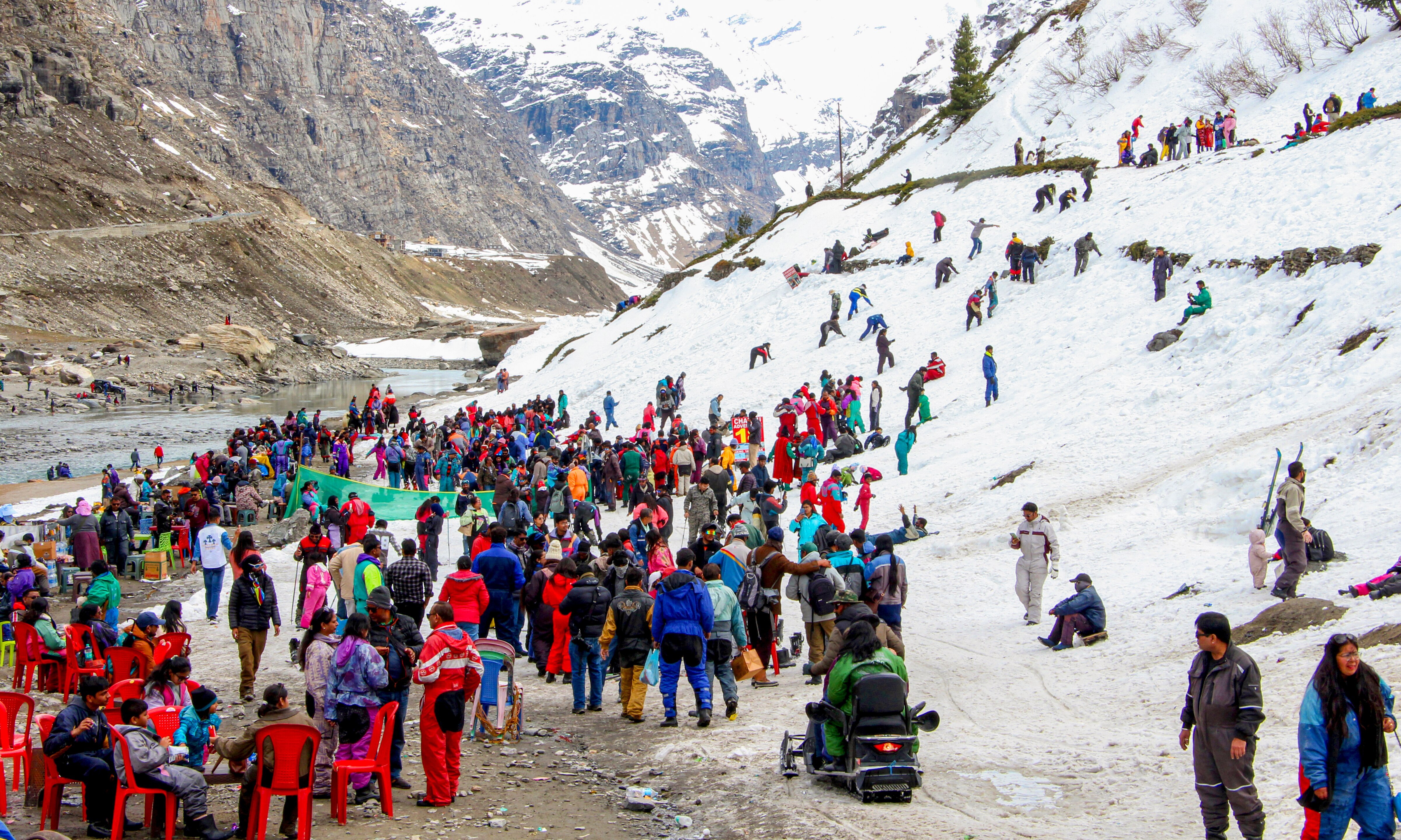 Tourists gather at the snow-covered area in Lahaul and Spiti district in Himachal Pradesh. (Photo: PTI)