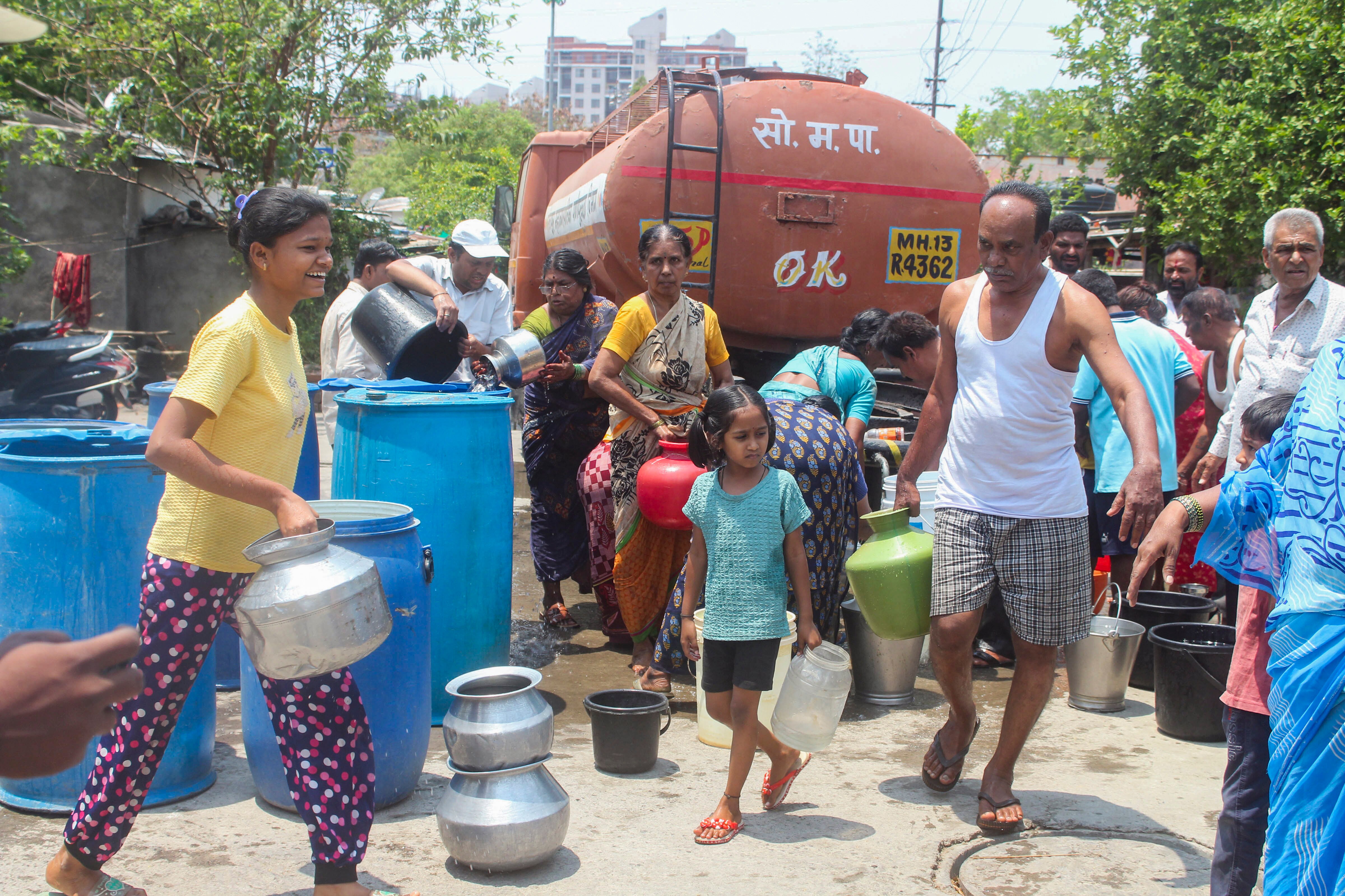 People collect water from a tanker due to water shortage in Maharashtra. (Photo: PTI)