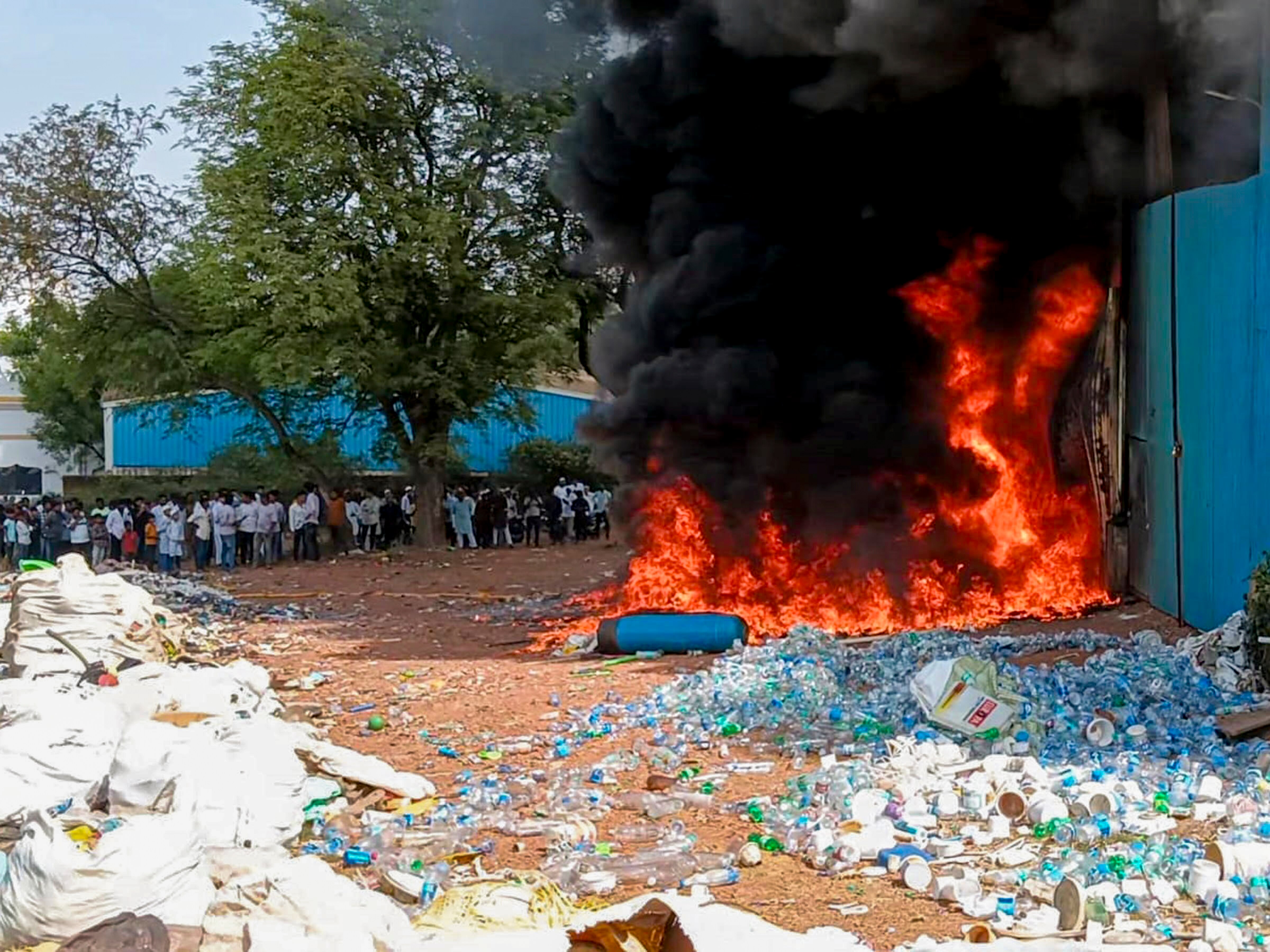 Smoke and flames billow after a fire at a plastic scrap godown. (Photo: PTI)
