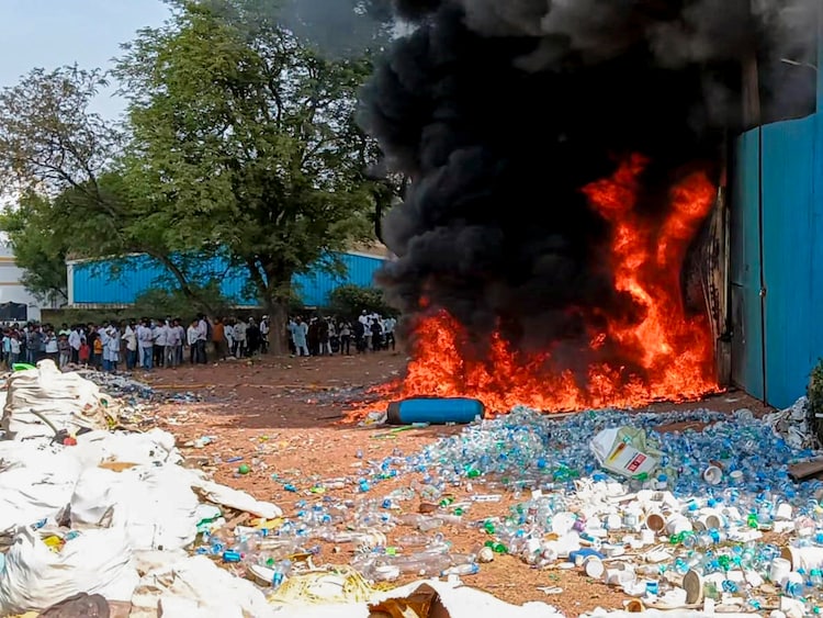 Smoke and flames billow after a fire at a plastic scrap godown. (Photo: PTI)