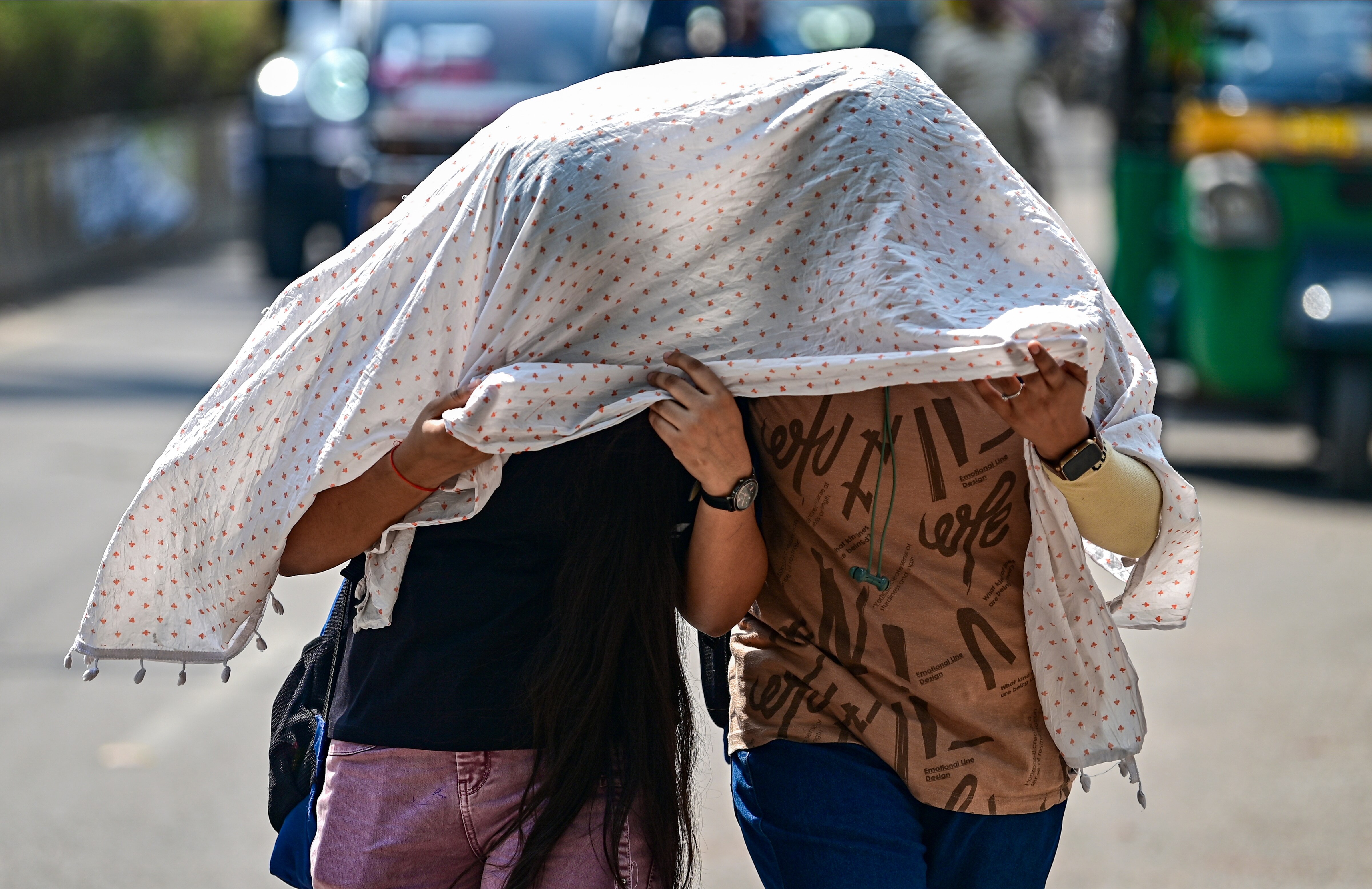 Women cover themselves on a hot summer day, in Prayagraj, Uttar Pradesh. (Photo: PTI)