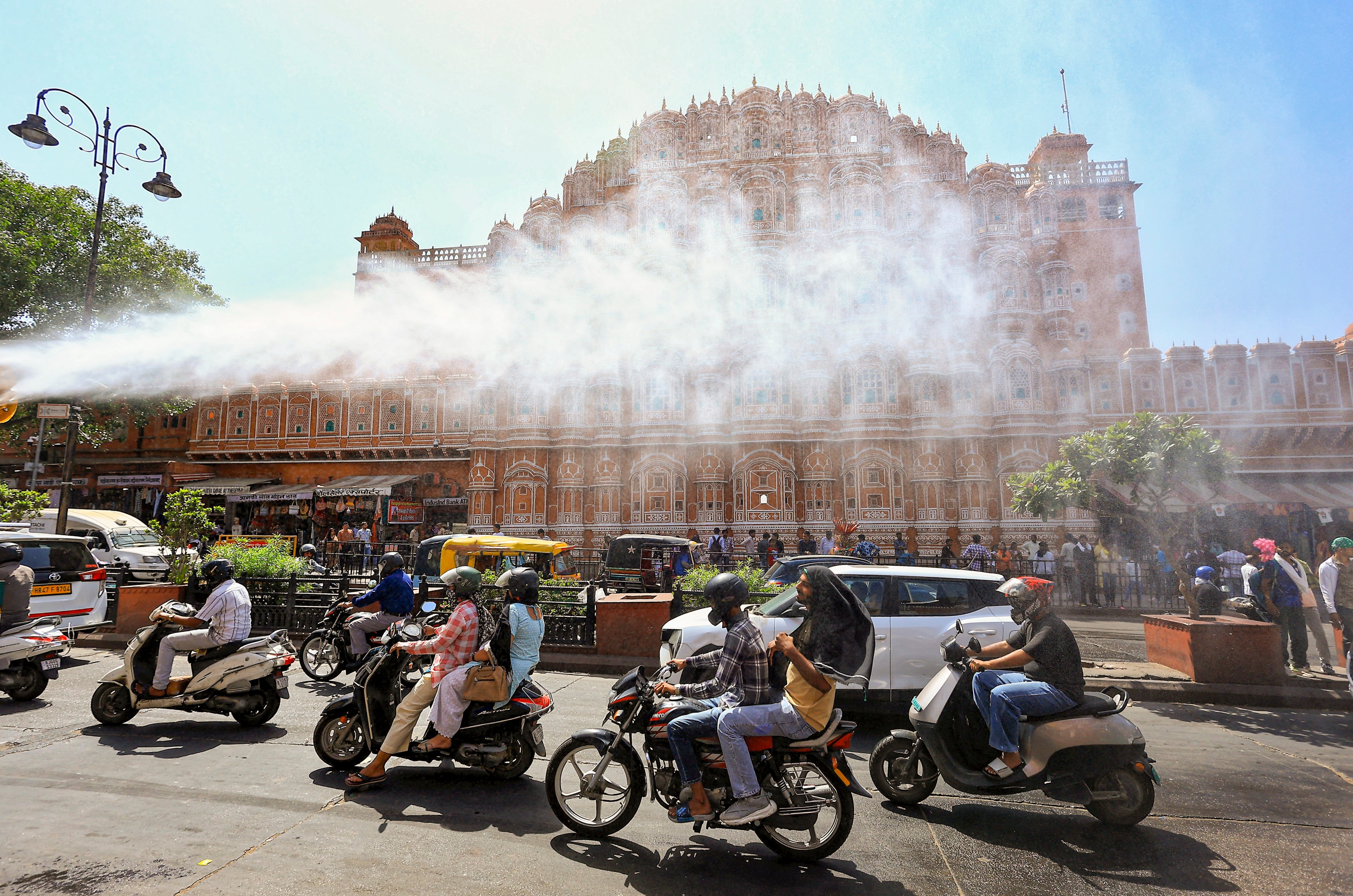 A sprinkler truck sprays water on a hot day in Jaipur. (Photo: PTI)
