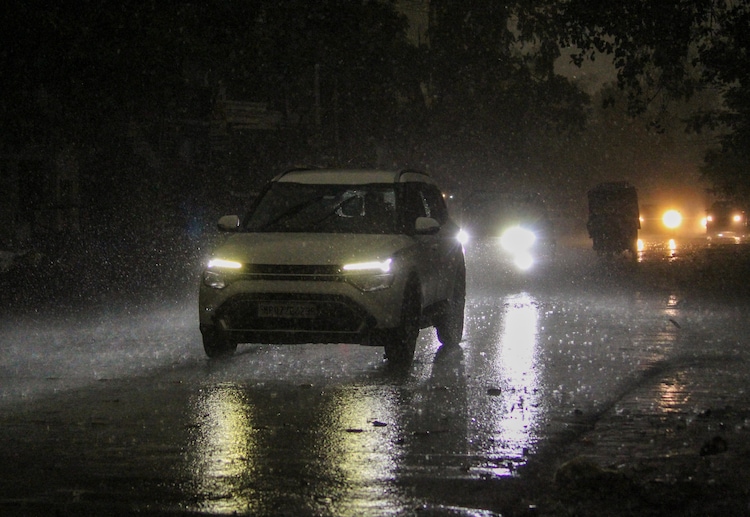 A car passes through on a rainy day, in Rishikesh. (Photo: PTI)