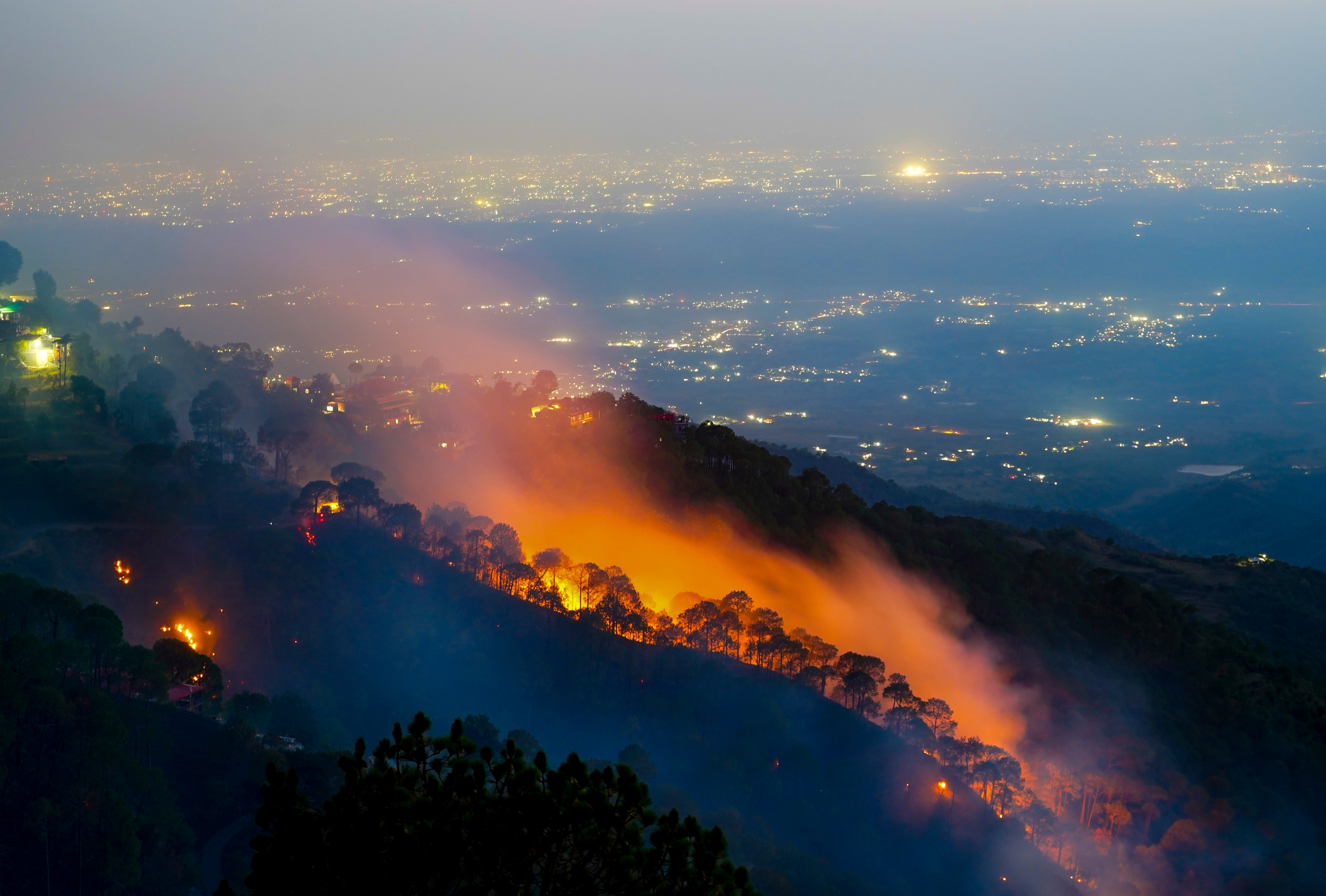 Flames and smoke billow during a forest fire, in Kasauli, Solan district. (Photo: PTI)