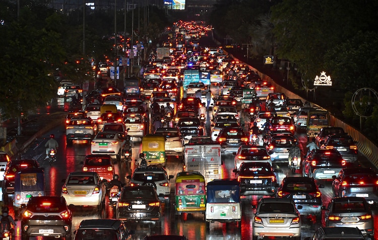 Vehicles stuck in traffic amid rain, in Noida. (Photo: PTI)