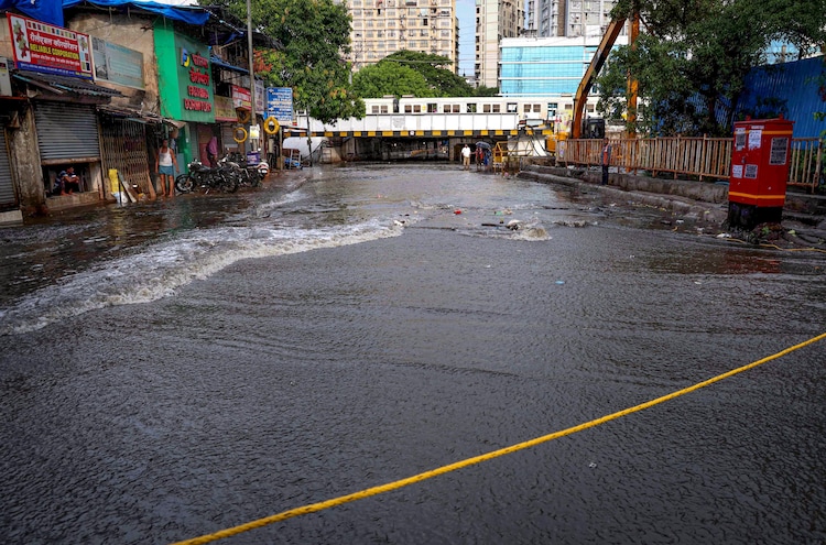 Water accumulates on a road near a subway after rain, in Mumbai in June. (Photo: PTI)