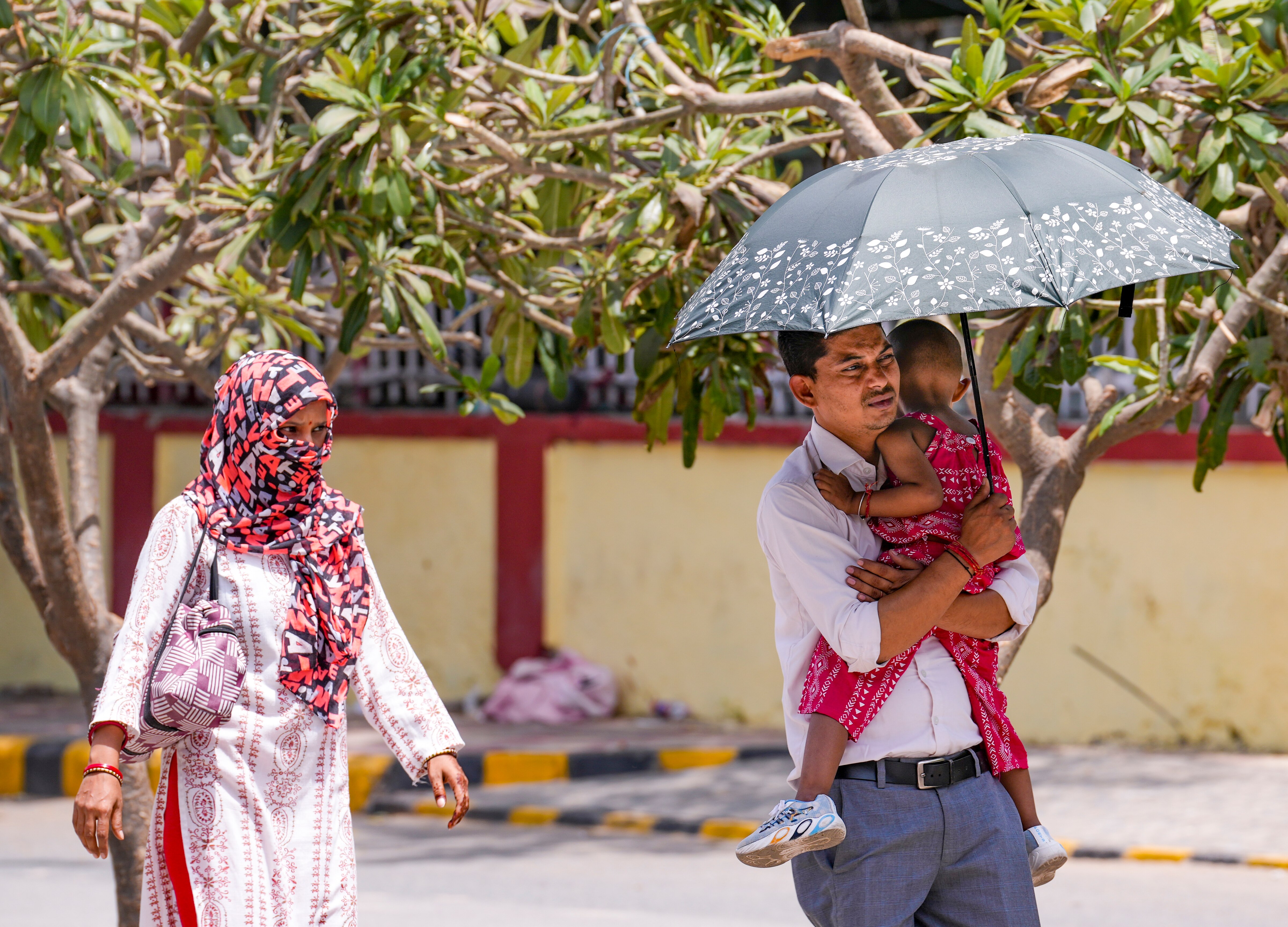 People shield themselves from a scorching Sun in Uttar Pradesh. (Photo: PTI)