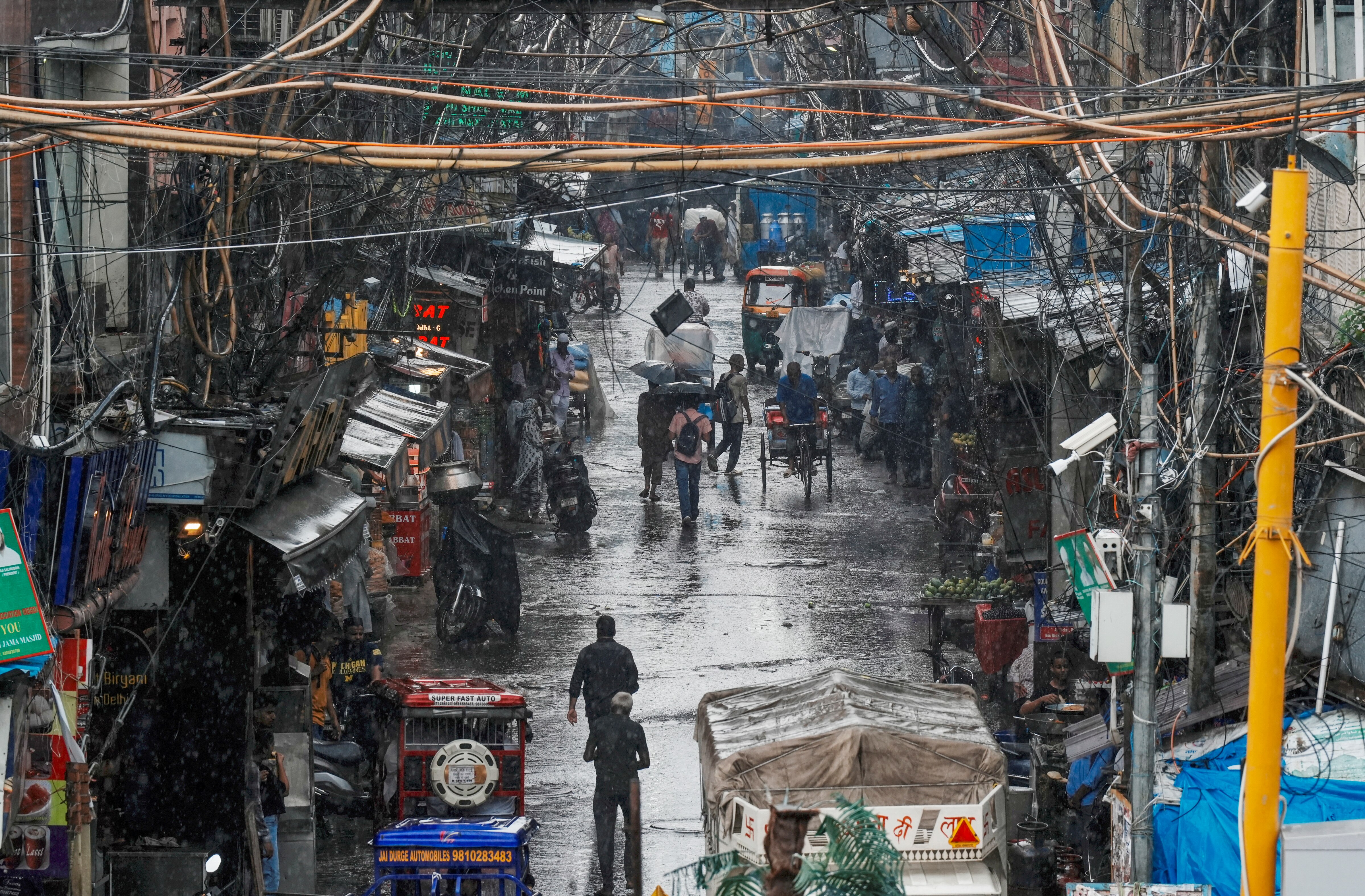 A Delhi street is seen amid rain. (Photo: PTI)