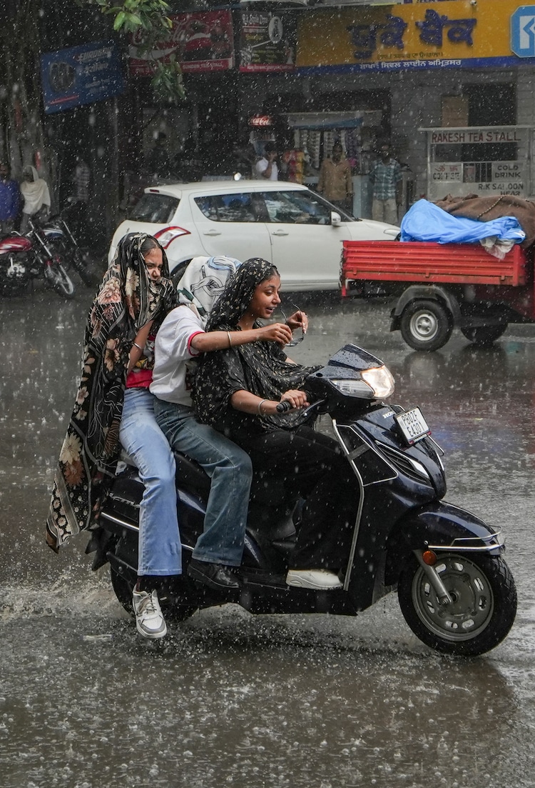People drive amid monsoon rains. (Photo: PTI)