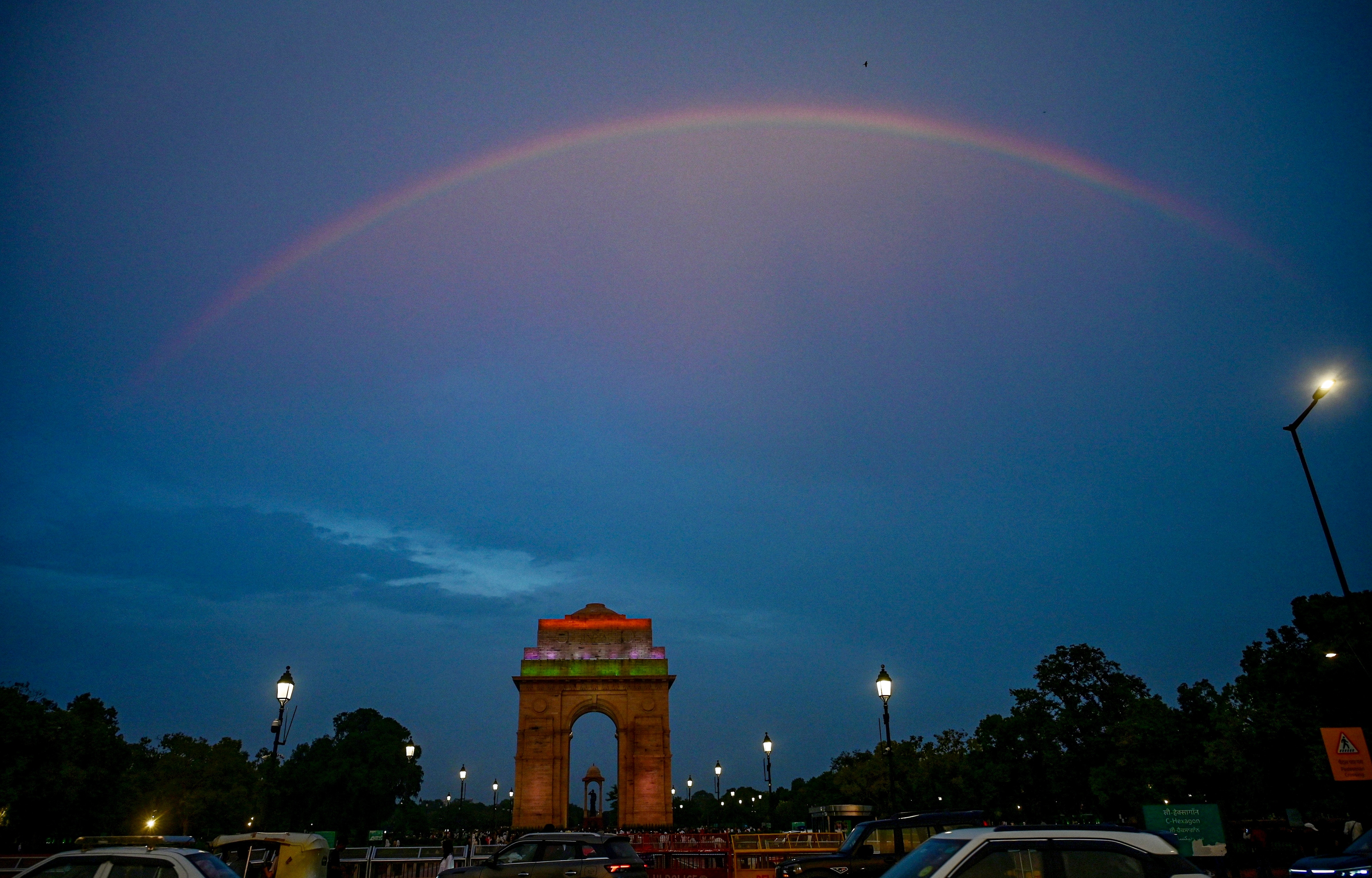 A rainbow arches over India Gate following rain, in New Delhi. (Photo: PTI)