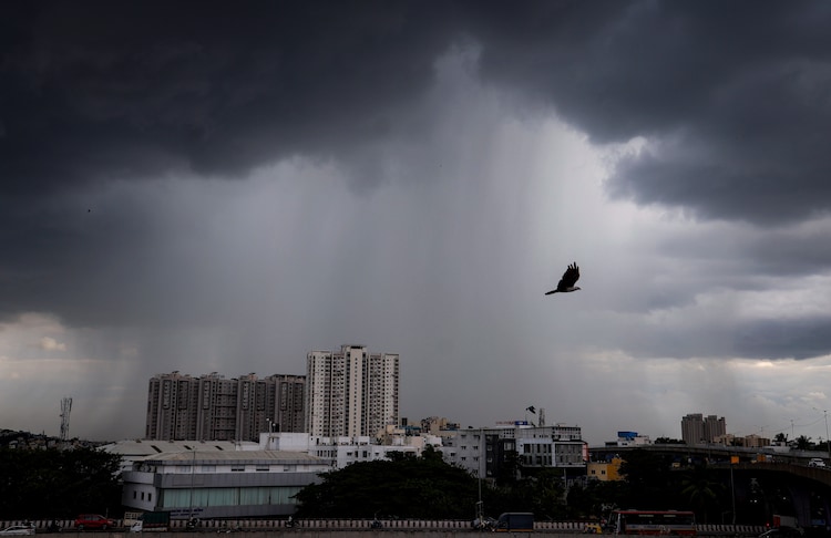 Dark monsoon clouds gather over the city as rain lashes parts of Bengaluru. (Photo: PTI)