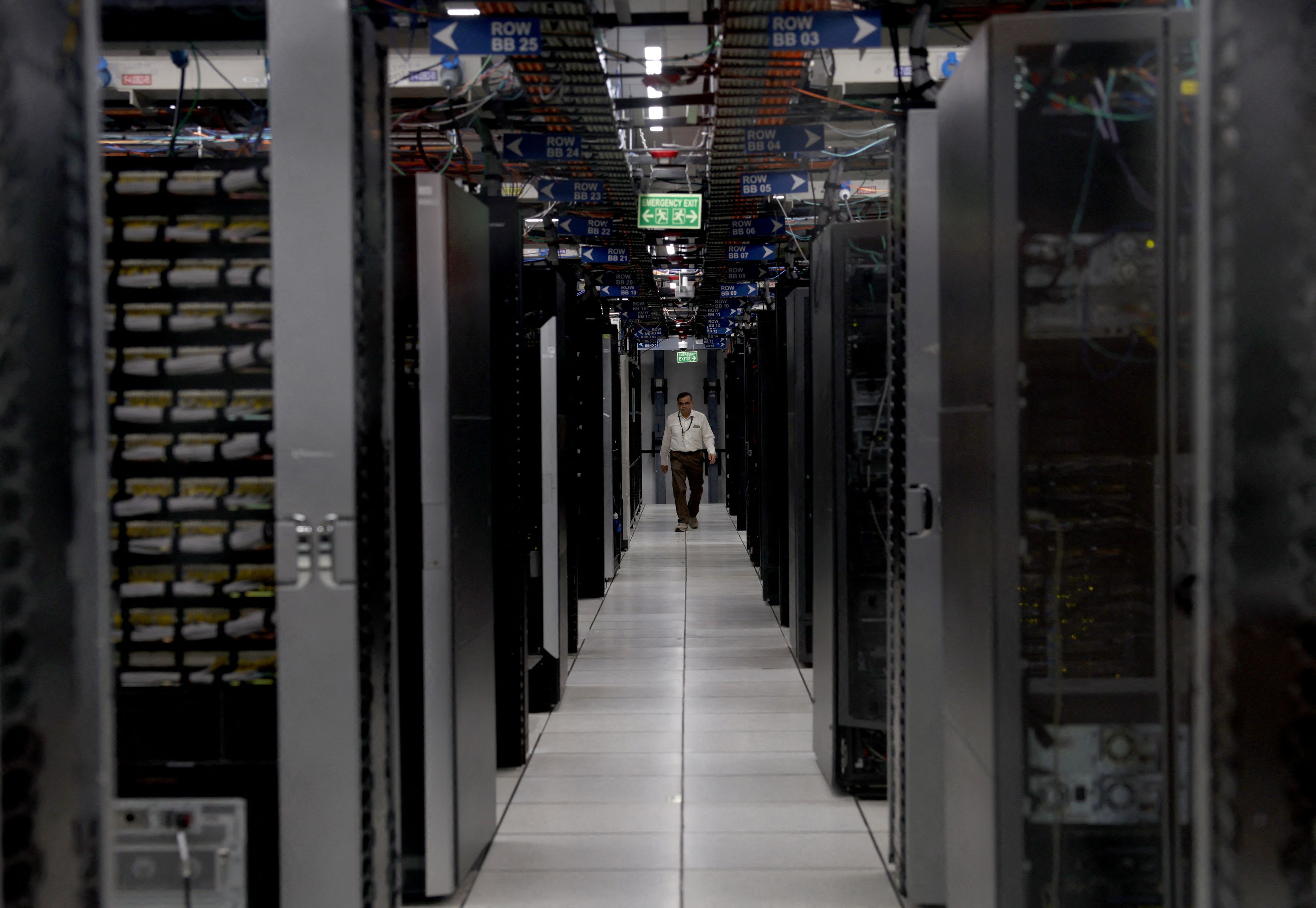 A lady walks through a data center. (Photo: Reuters)