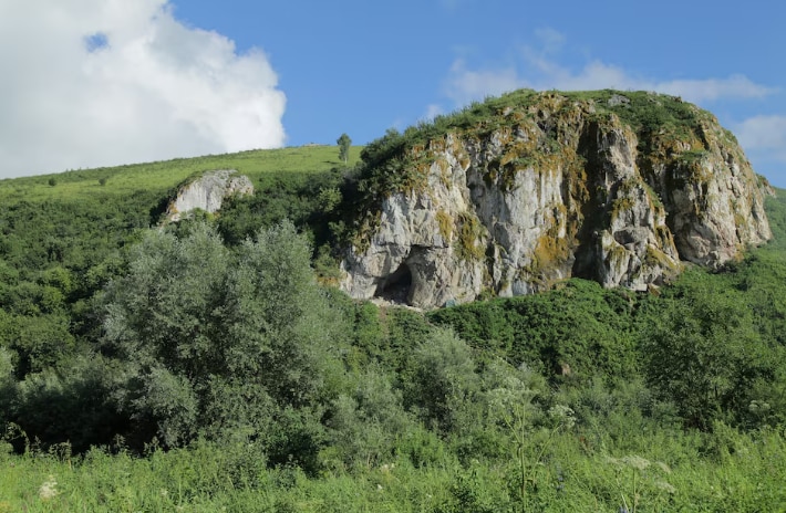 The exterior of Chagyrskaya Cave in Siberia where the tooth was discovered. (Photo: Reuters)