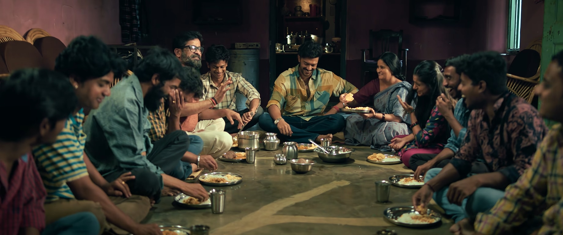A scene from the trailer of Mango Pacha featuring the lead character with his family and friends