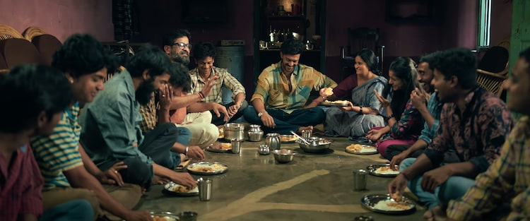 A scene from the trailer of Mango Pacha featuring the lead character with his family and friends