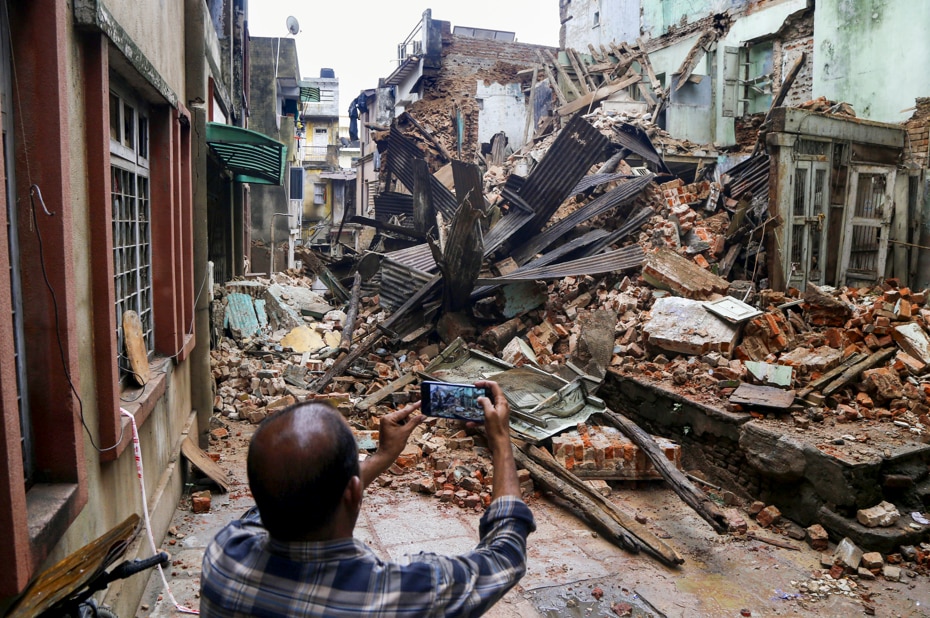 A collapsed building is seen in Gujarat after heavy monsoon rain. (Photo: PTI)