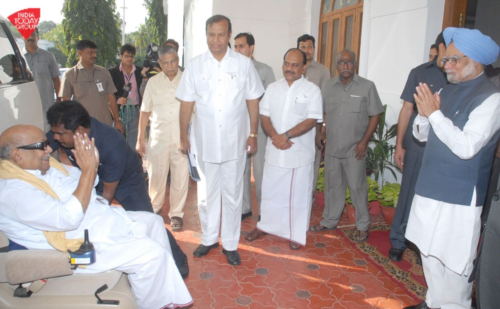 File photo of M. K. Karunanidhi with Manmohan Singh - allies in power and partners in coalition-era politics.