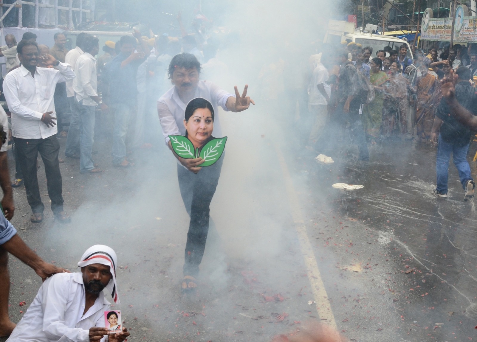 AIADMK workers celebrate after Jayalalithaa was granted bail by the Supreme Court in a disproportionate assets case, outside her residence in Poes Garden, Chennai (India Today)