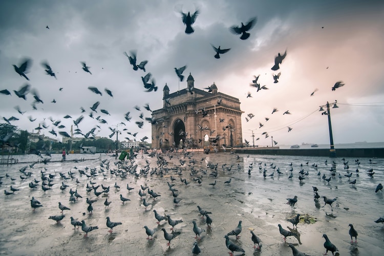 An image of the Gateway of India in Mumbai under overcast skies. (Photo: Unsplash)