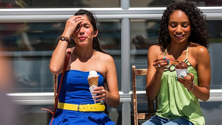 Women walk while eating ice cream on a hot day. (Representational Photo: Getty)