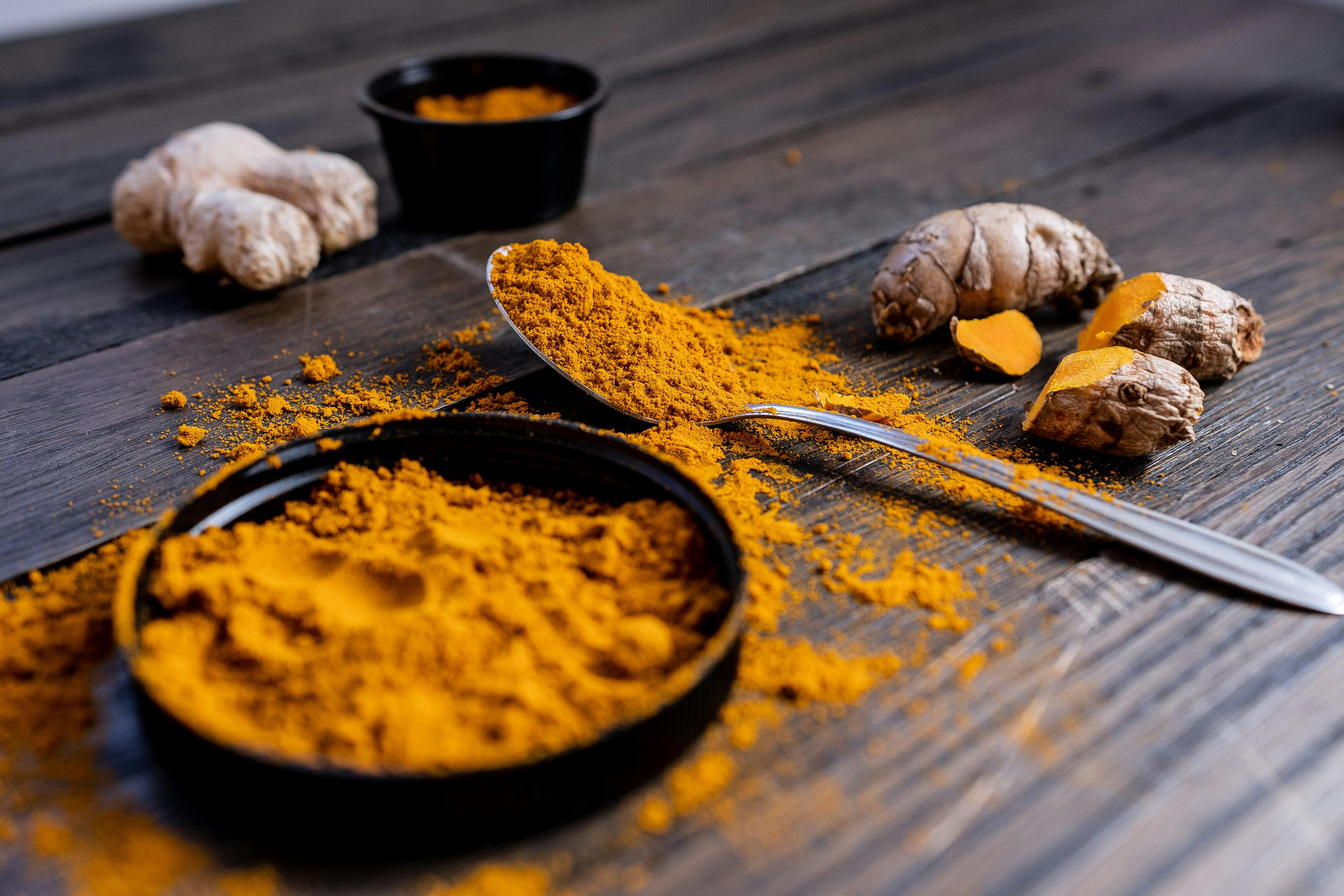 An image of a bright yellow turmeric powder sitting in a bowl. (Photo: Pexels)