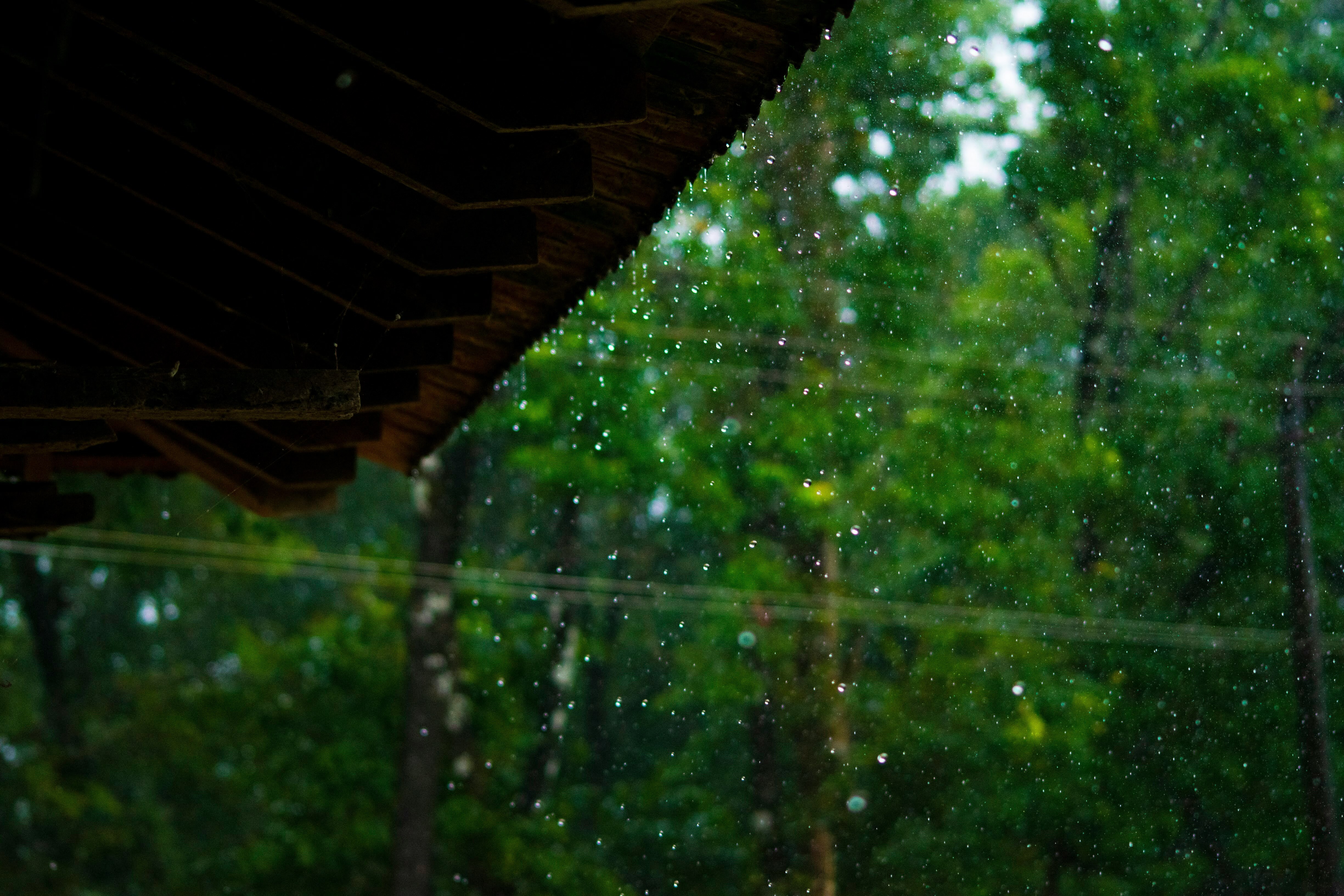 An image captures rain drops falling on a roof during a rain shower. (Photo: Unsplash)