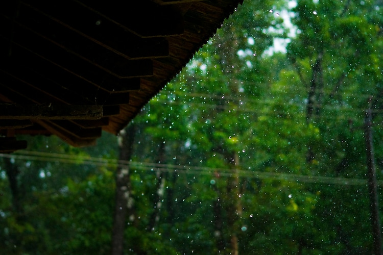 An image captures rain drops falling on a roof during a rain shower. (Photo: Unsplash)