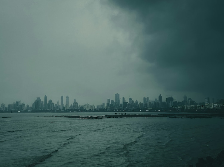 A skyline landscape on Mumbai under an overcast sky as rain falls. (Photo: Unsplash)