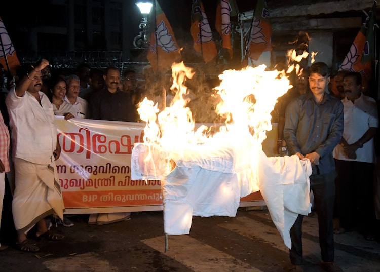 BJP members protest against CM Pinarayi Vijayan by burning an effigy in Thiruvananthapuram on Thursday. (PTI Image)
