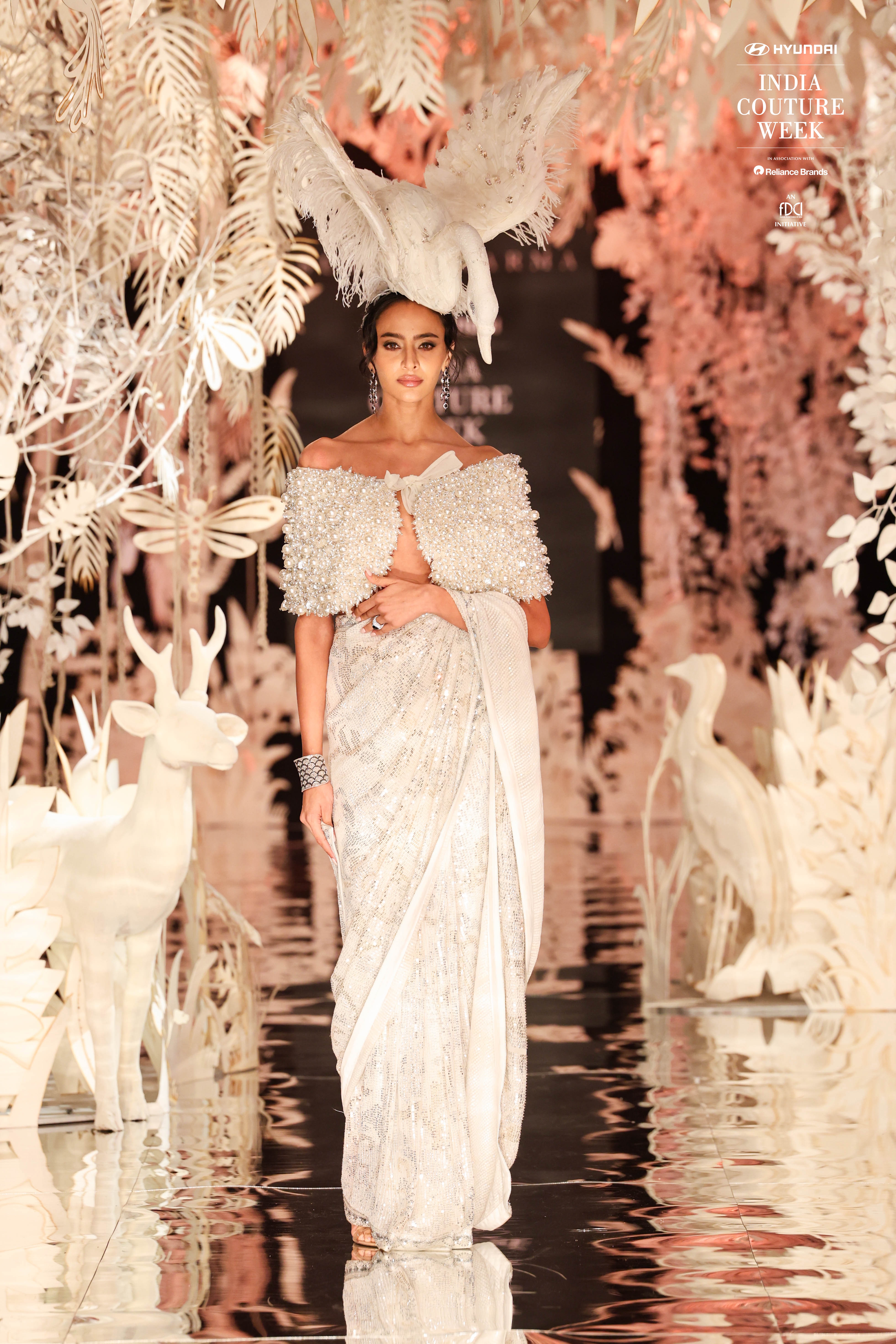 Model Stun in an Ivory Saree with a dramatic headgier on Sunit Verma's show