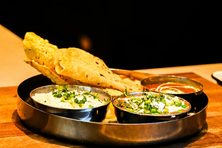 A plate of lentils, curd, pickle and salad is a completely balanced diet. (Photo: Pexles)