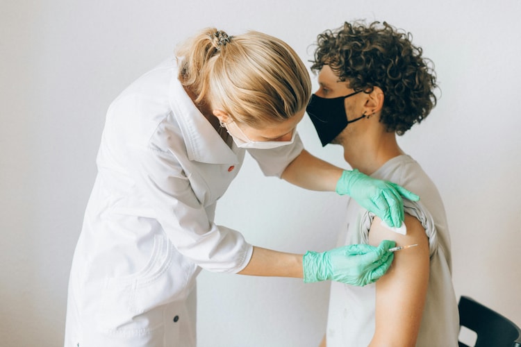 Young person being vaccinated