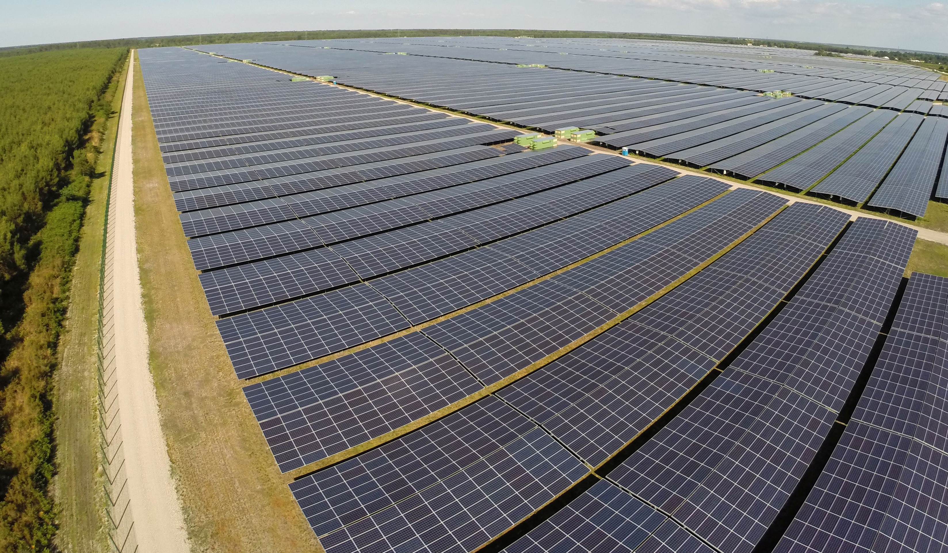 A vast solar farm stretches toward the horizon. On Earth Day 2026, data confirms that renewables overtook coal as the world's top electricity source for the first time since 1919. (Photo: Reuters)
