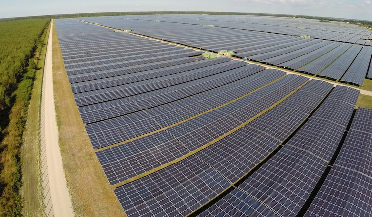 A vast solar farm stretches toward the horizon. On Earth Day 2026, data confirms that renewables overtook coal as the world's top electricity source for the first time since 1919. (Photo: Reuters)