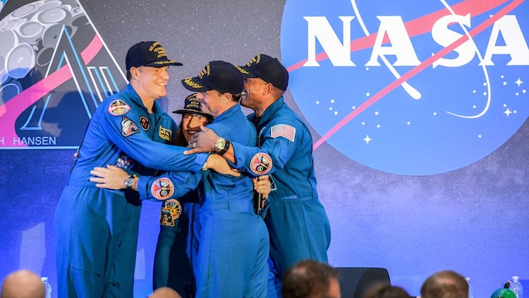 The Artemis II crew share a group hug on stage in Houston. The four astronauts completed a 1,118,793-kilometre journey around the Moon, the first crewed lunar voyage since Apollo 17 in 1972. (Photo: Nasa)