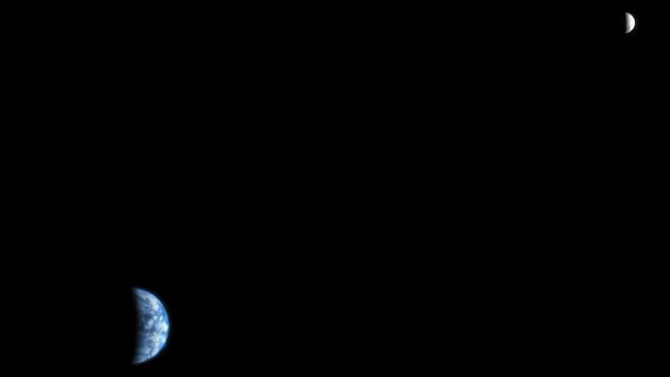 Earth glows blue in the lower left while the Moon appears as a pale crescent in the upper right, in this composite image taken by NASA's HiRISE camera aboard the Mars Reconnaissance Orbiter on October 3, 2007, from a distance of 142 million kilometres. (Photo: NASA/JPL-Caltech/University of Arizona)