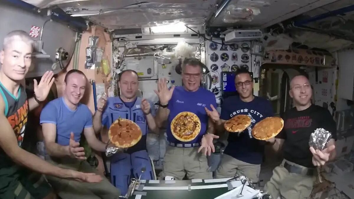 Expedition 53 crew members on the International Space Station show off their pizzas. (Photo: Nasa)
