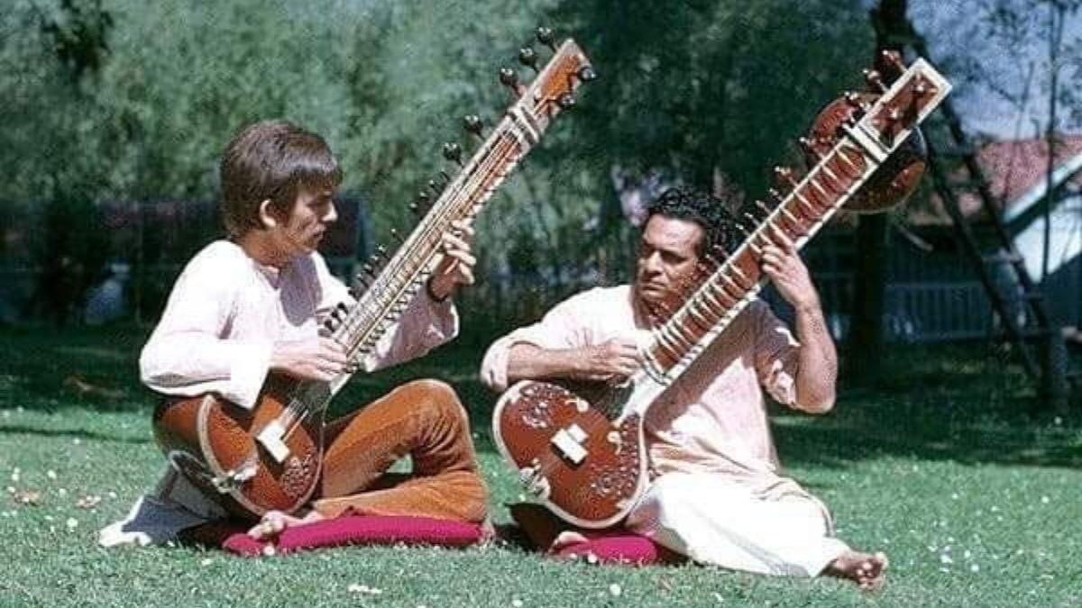 Pandit Ravi Shankar teaching George Harrison the sitar. (Photo: X)