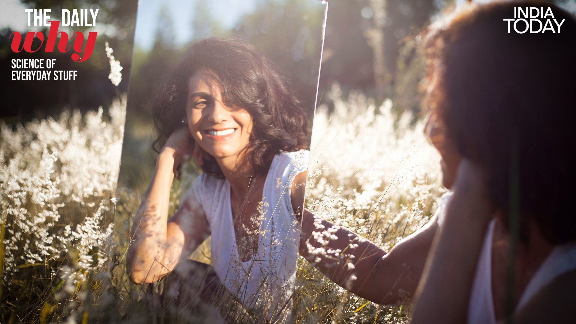 A woman looking at herself in a mirror. (Photo: Unsplash)