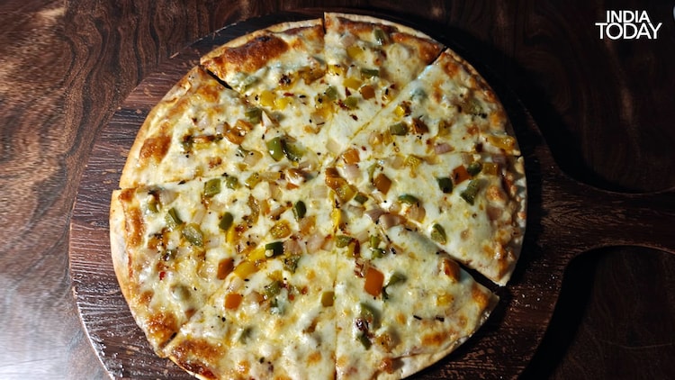 The Margherita pizza that went cold at Pint of Science 2026. When the science is this good, food can wait. (Photo: Radifah Kabir/India Today)