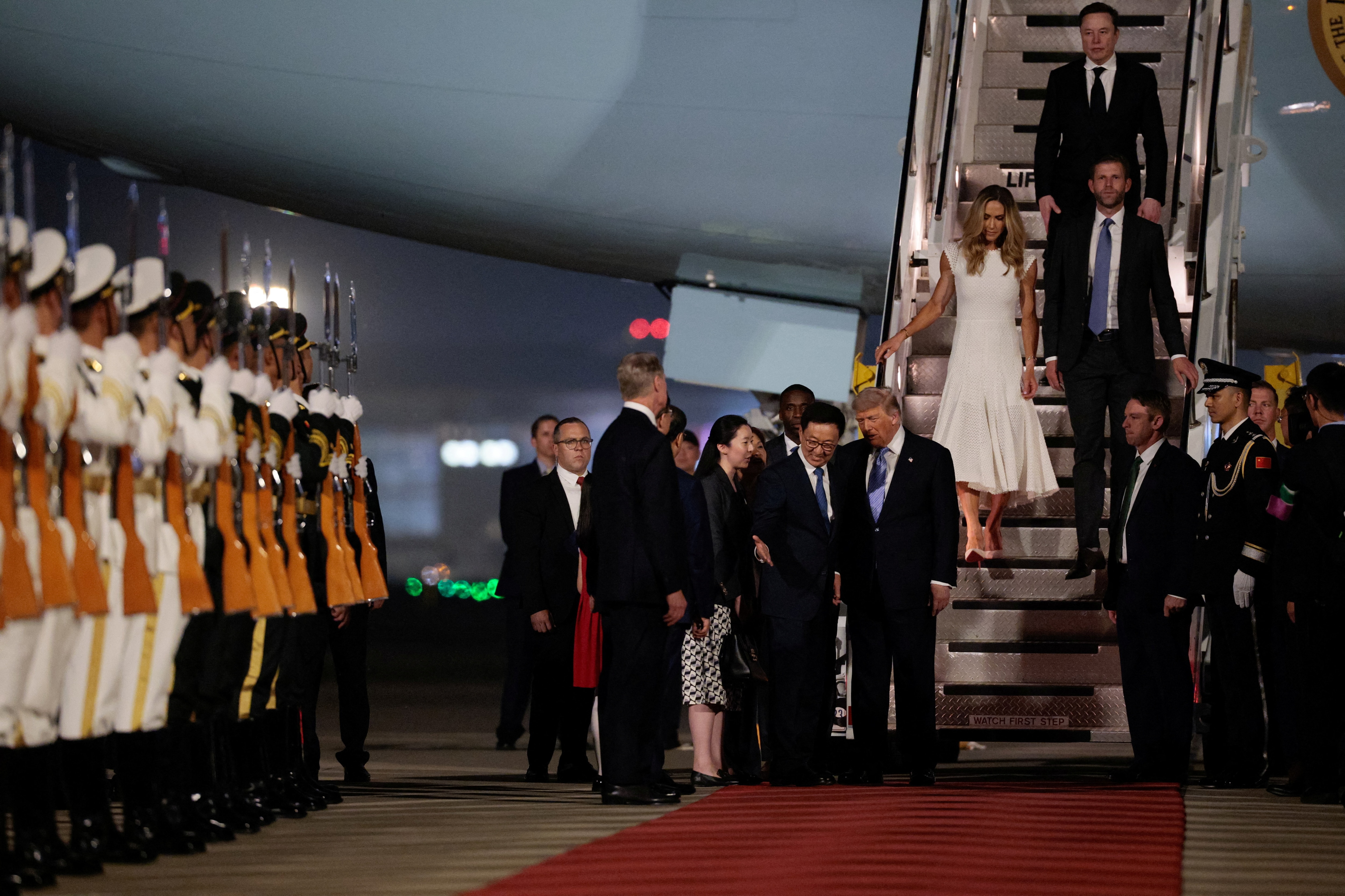 Donald Trump, Elon Musk, Eric Trump and his wife Lara, participate in an arrival ceremony at Beijing Capital International Airport, in Beijing, China. (Photo: Reuters)